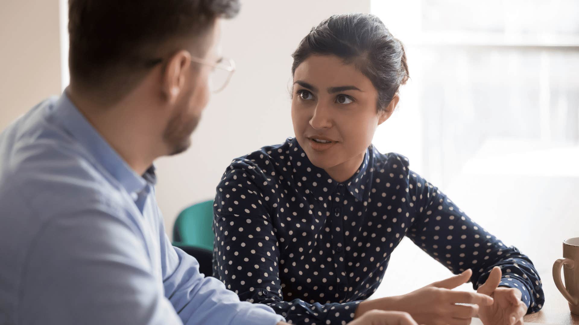 woman listening to man talk