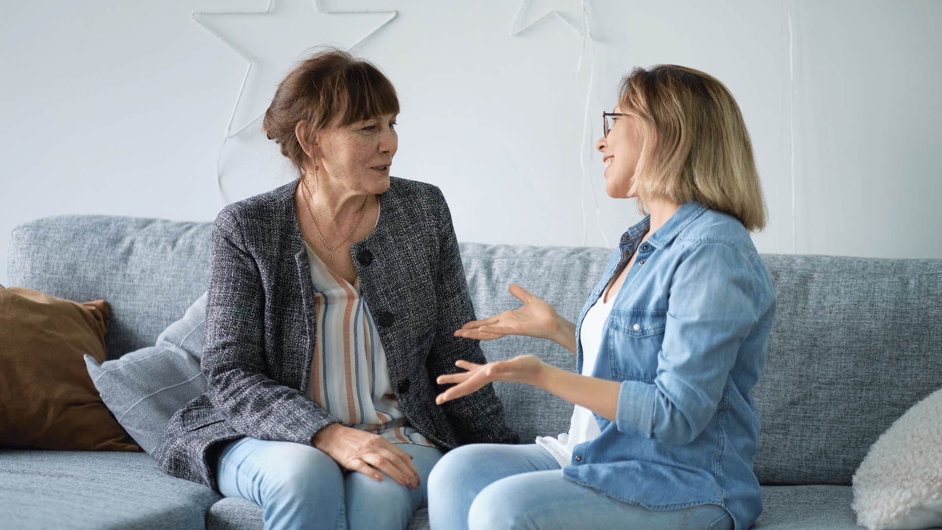 relaxed older woman talking to younger woman