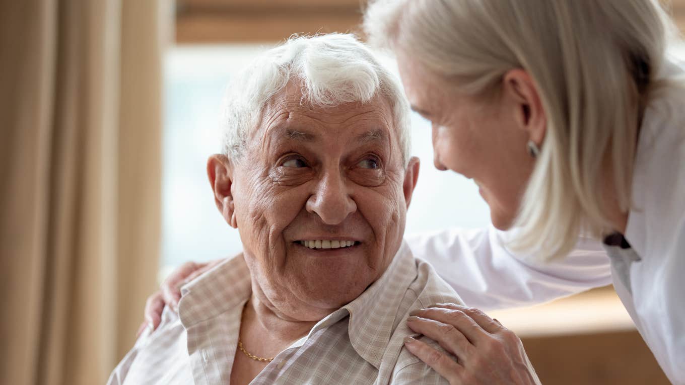 boomer man smiling and looking at his wife