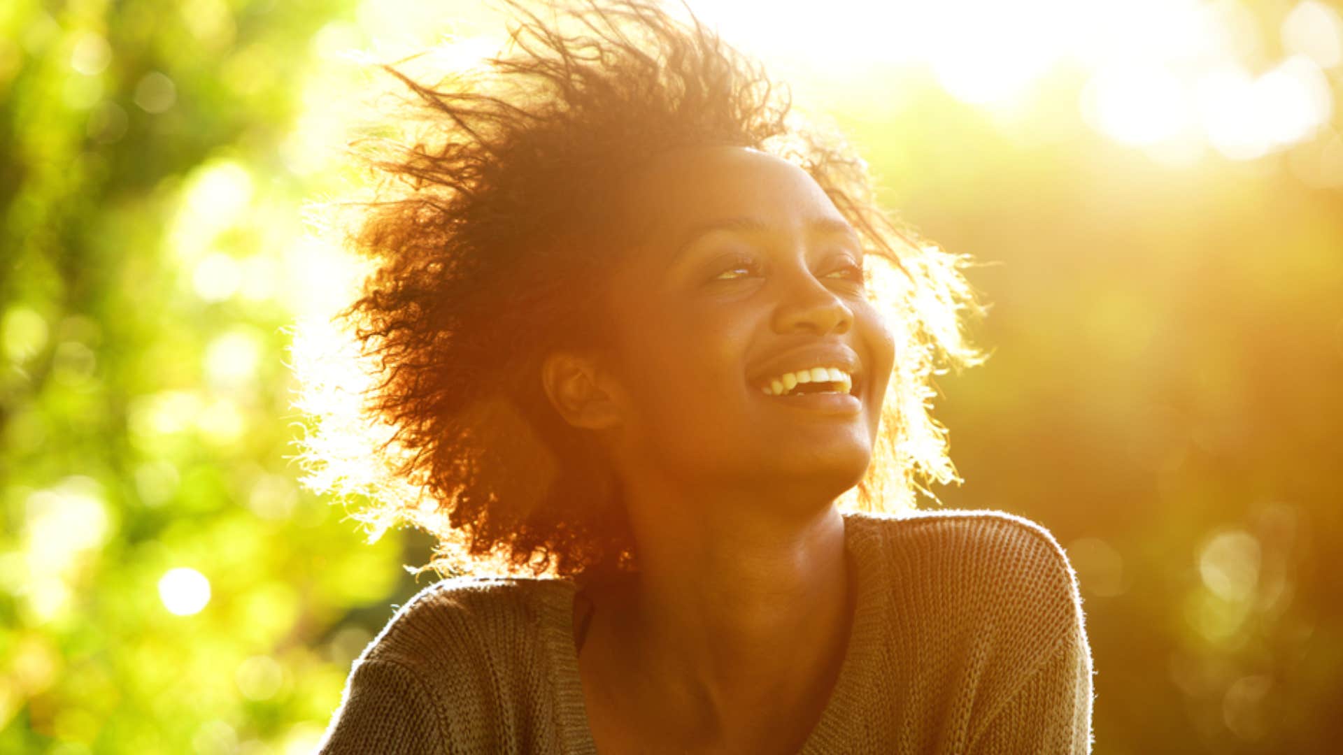 woman smiling in the sunshine