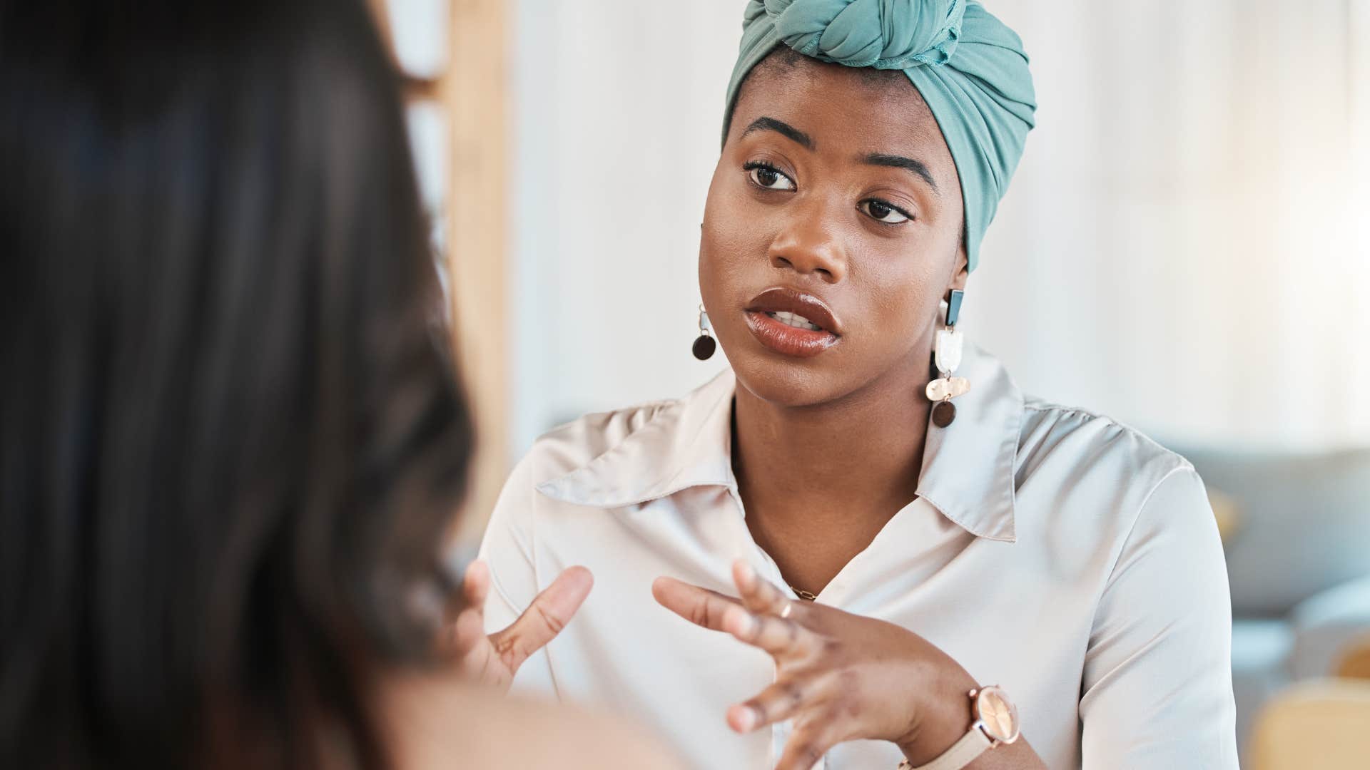 assertive woman protecting herself from manipulative peer