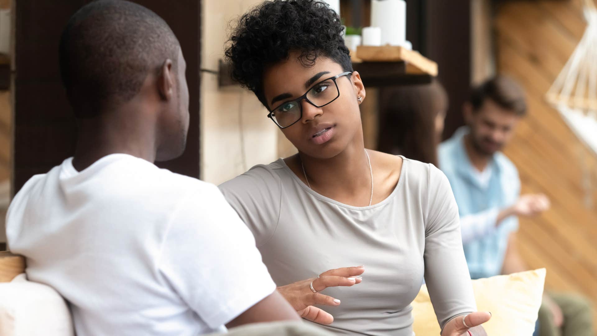 Woman having a serious conversation with a man.