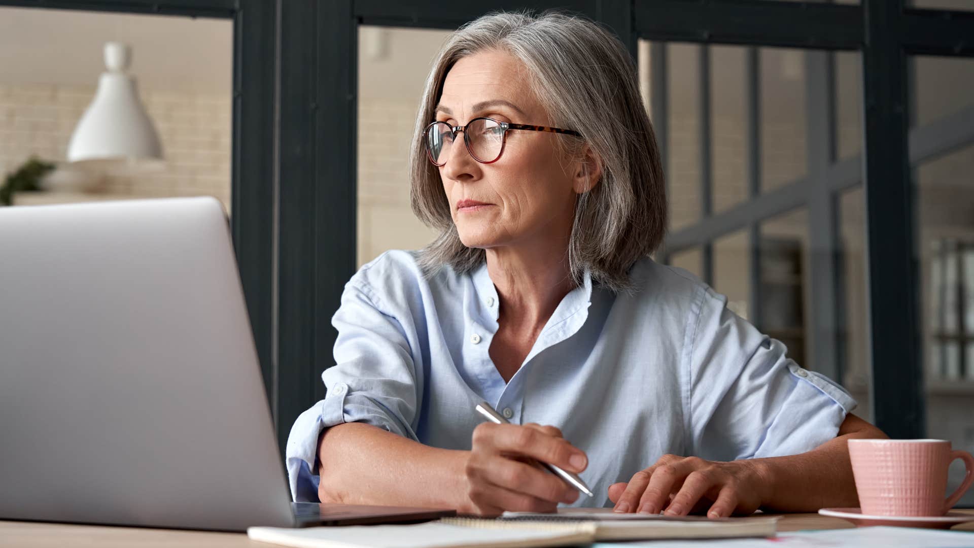 Professional woman working at her desk in an office.