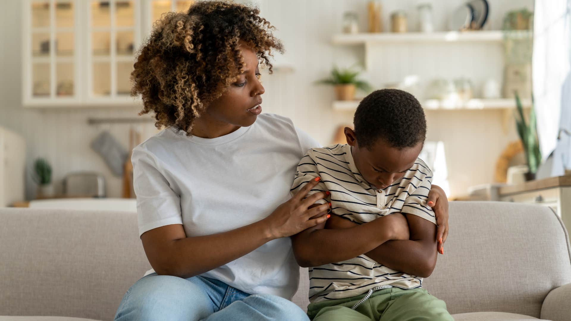 mother comforting sad little boy