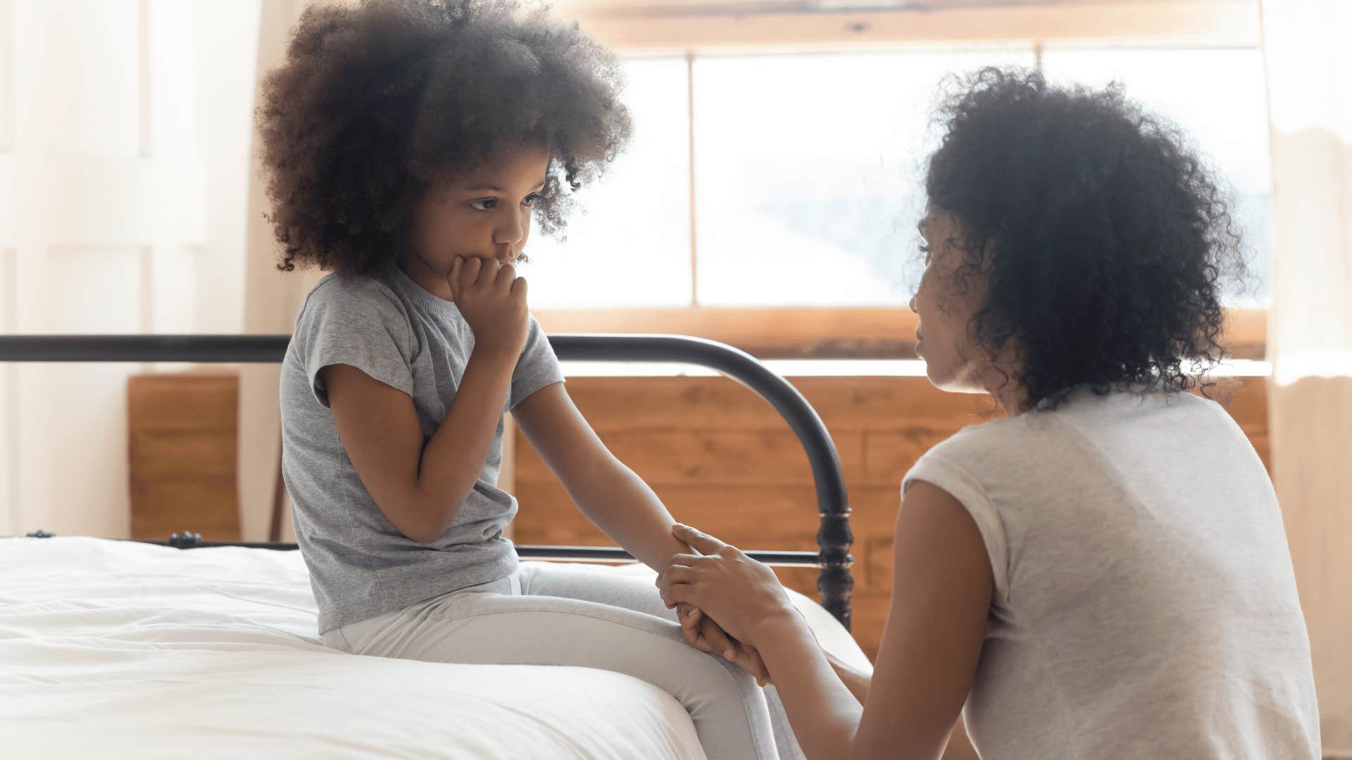 mother talking to daughter