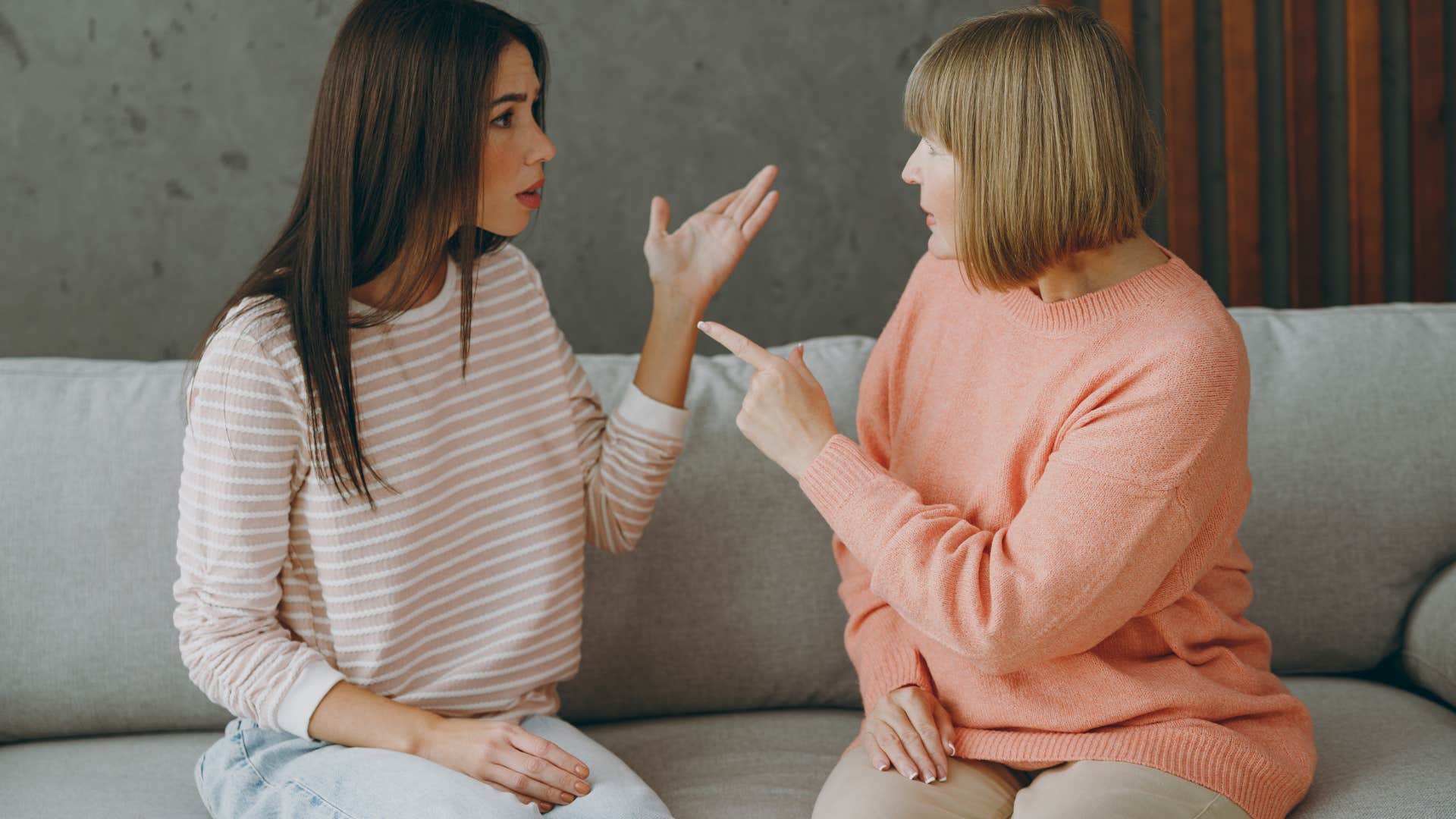 mother scolding adult daughter to grow up