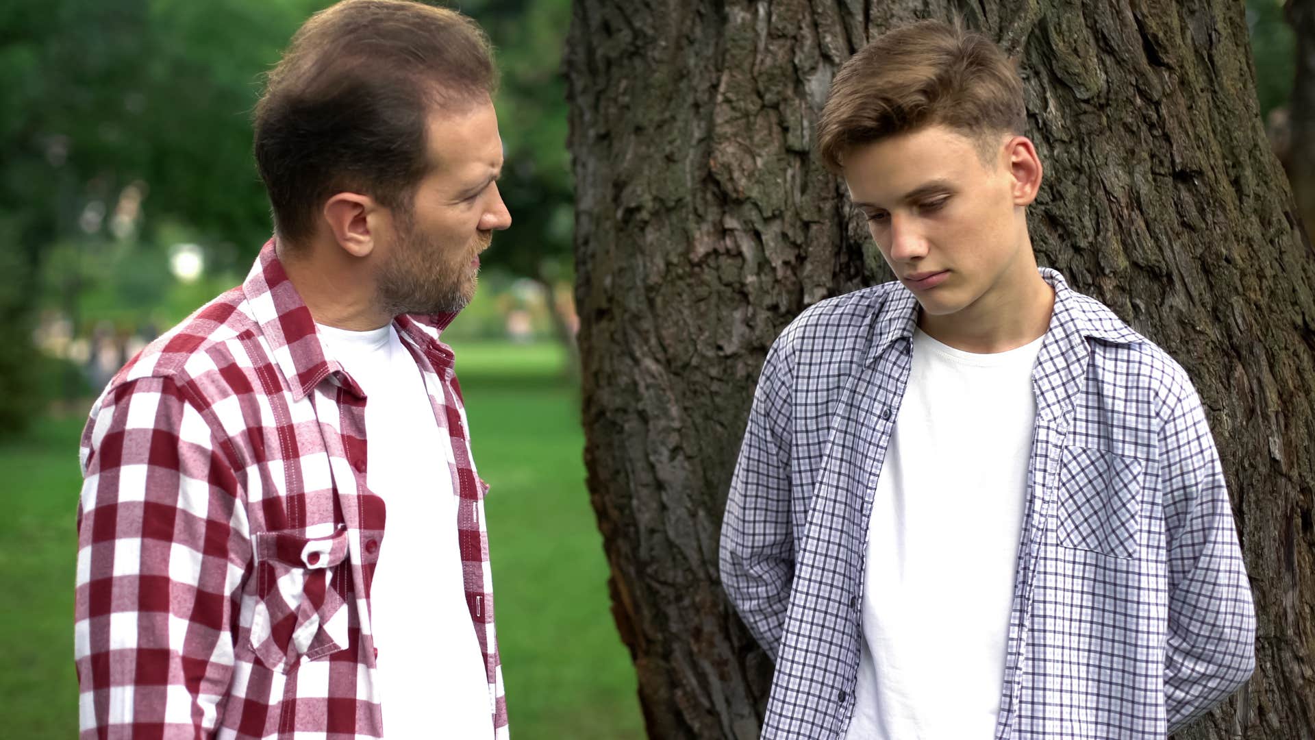 father tells his son outside that he is the reason why someone else is upset