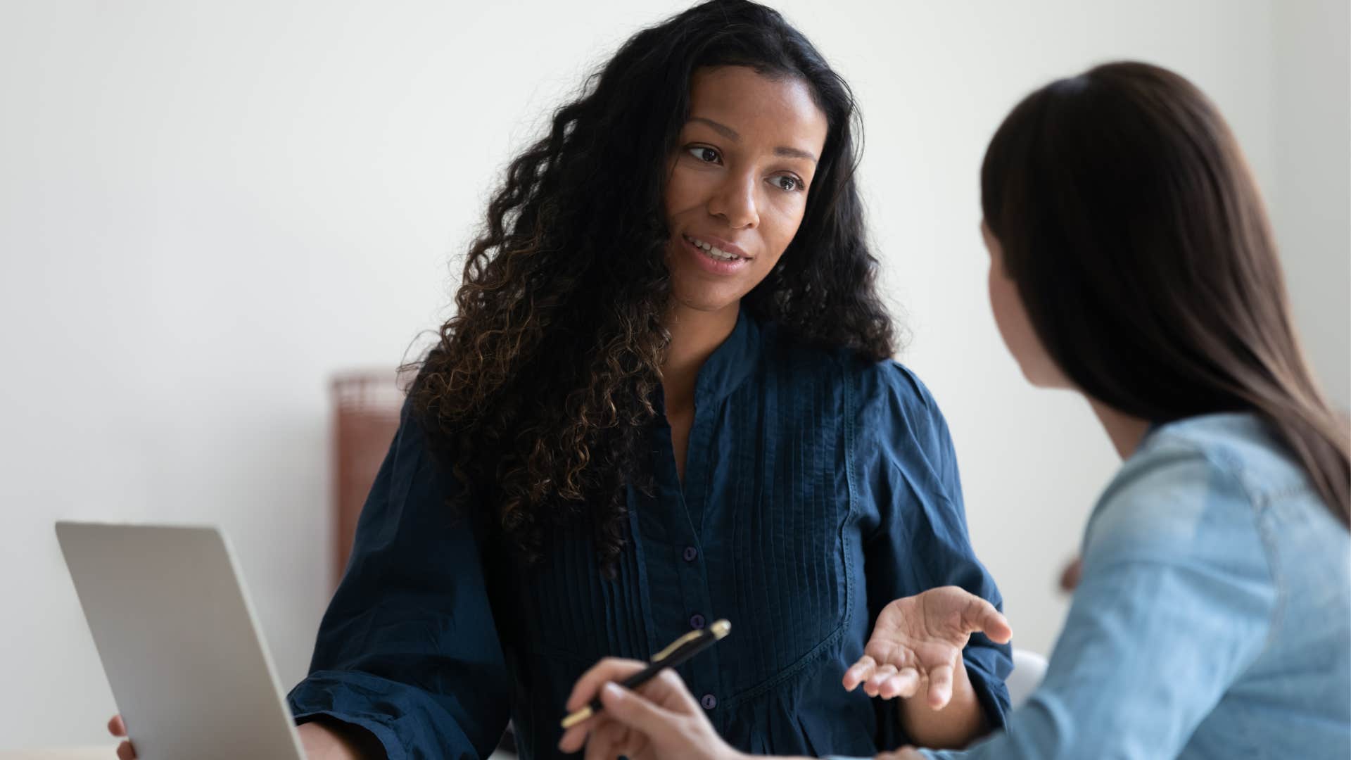 A woman in the workplace asks her coworker to help her understand their conflict.