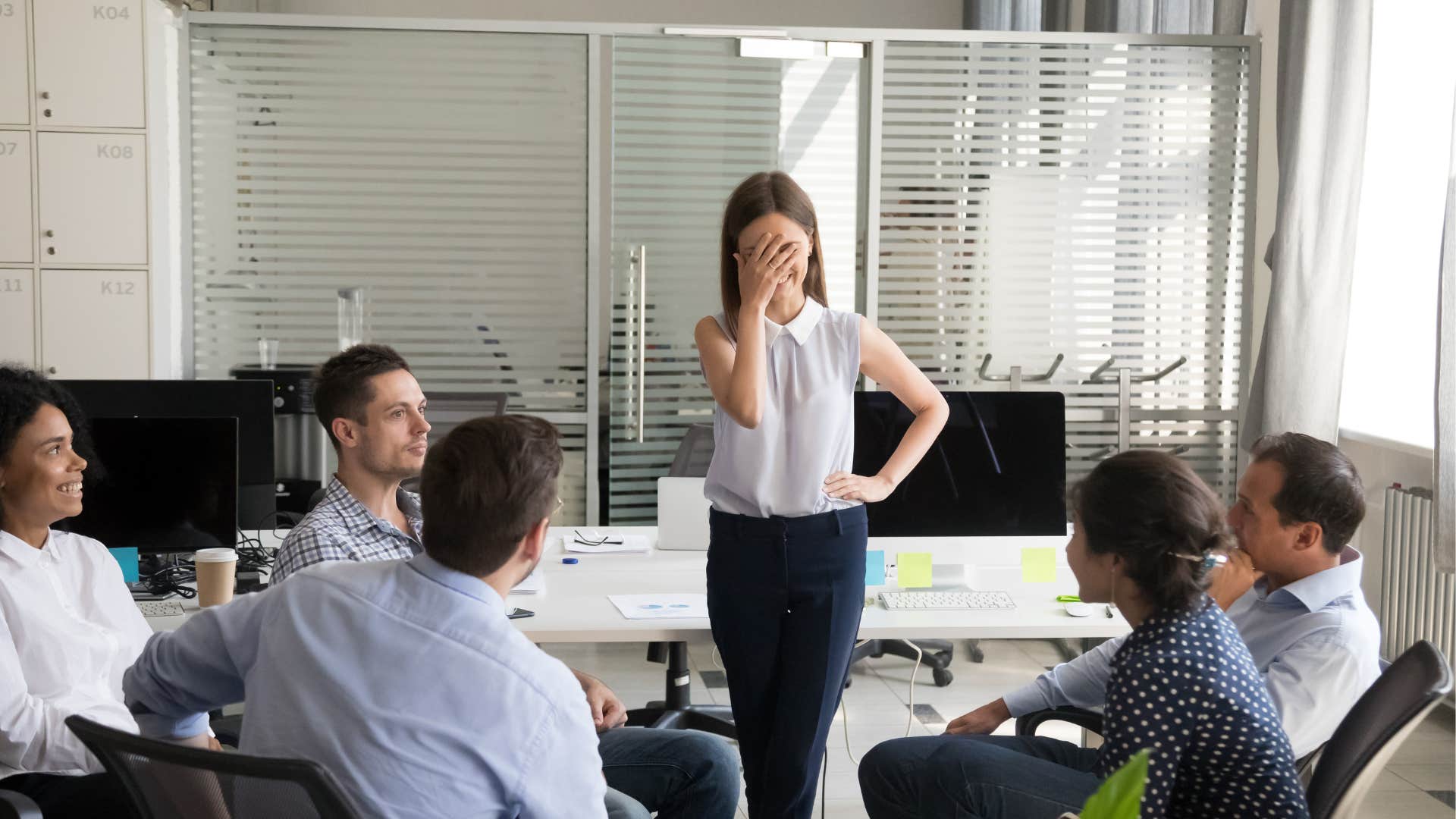 woman feels embarrassed after her coworkers say they are not judging her