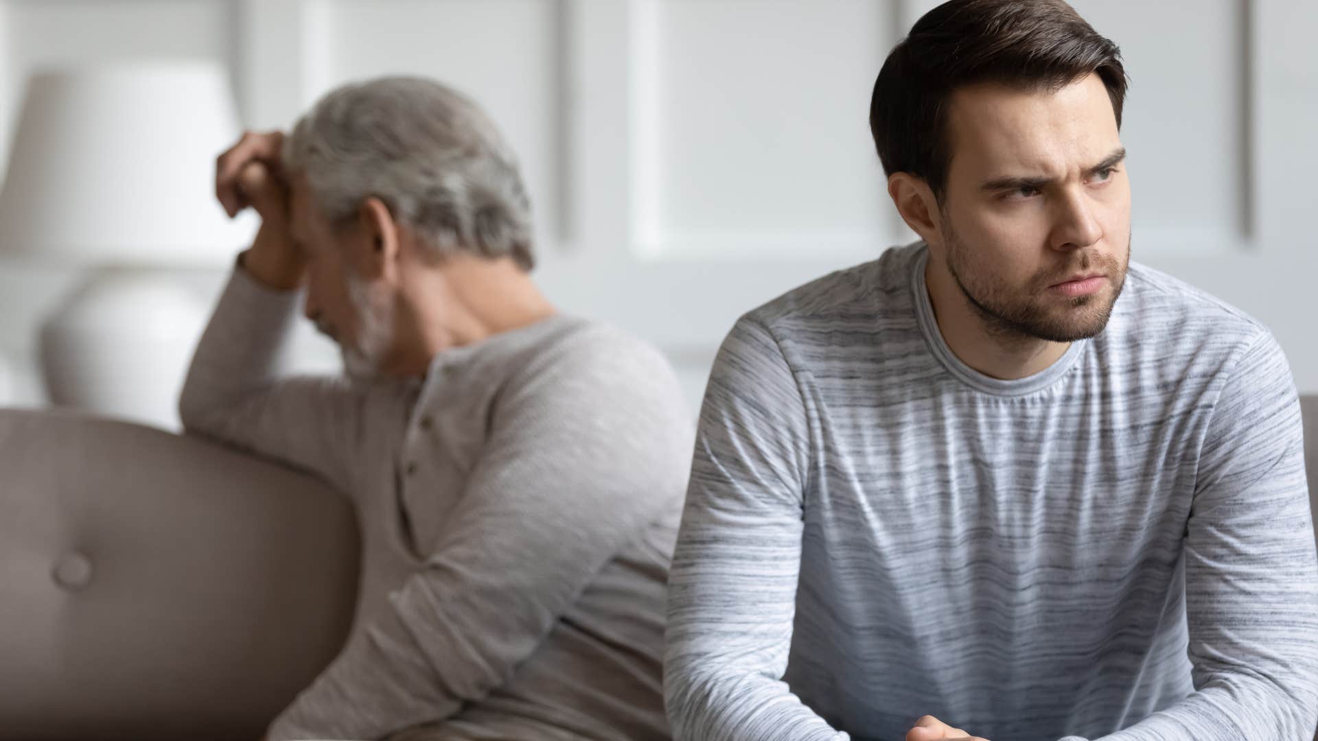 upset man turned away from his father