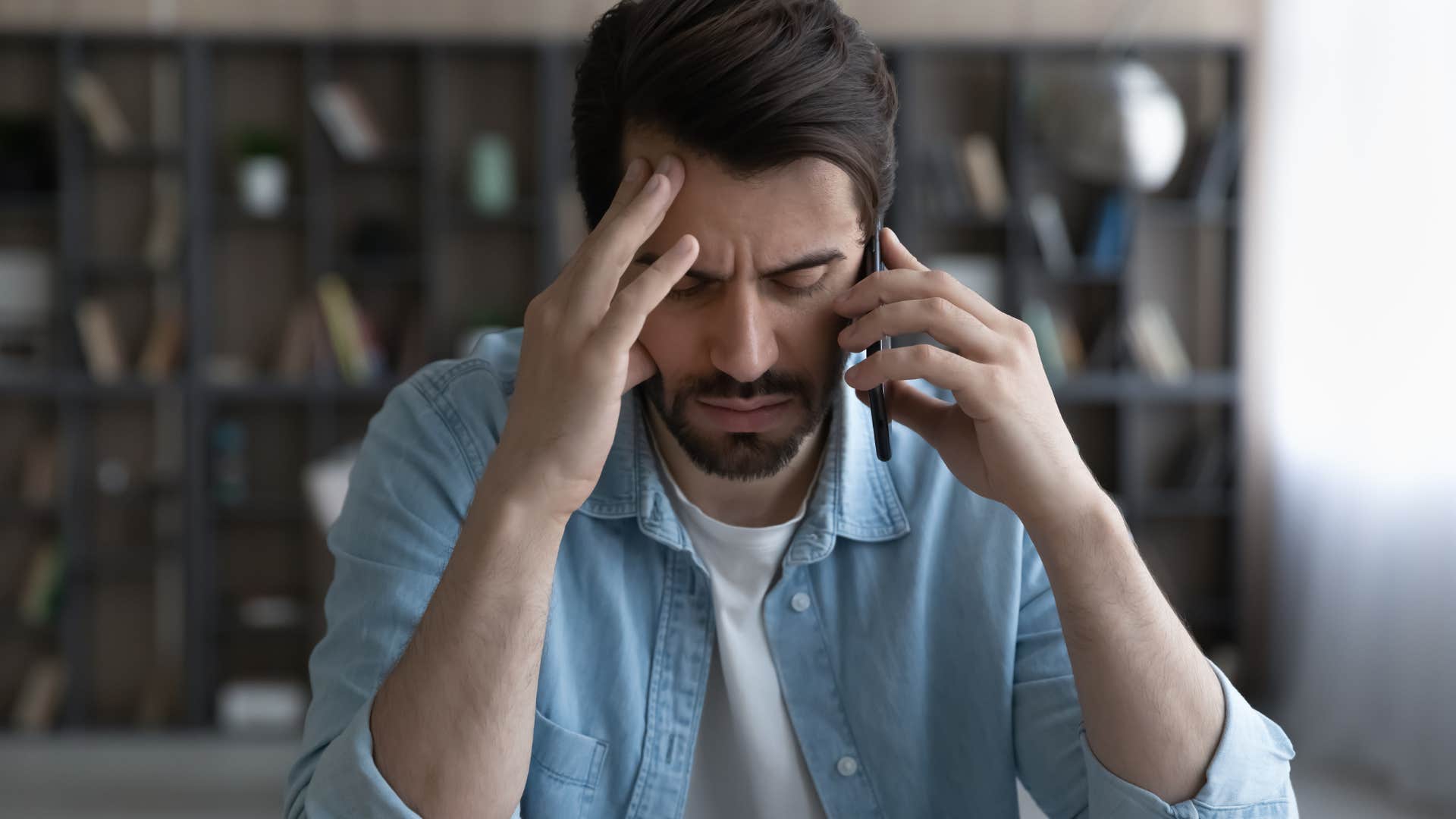 stressed man talking on phone