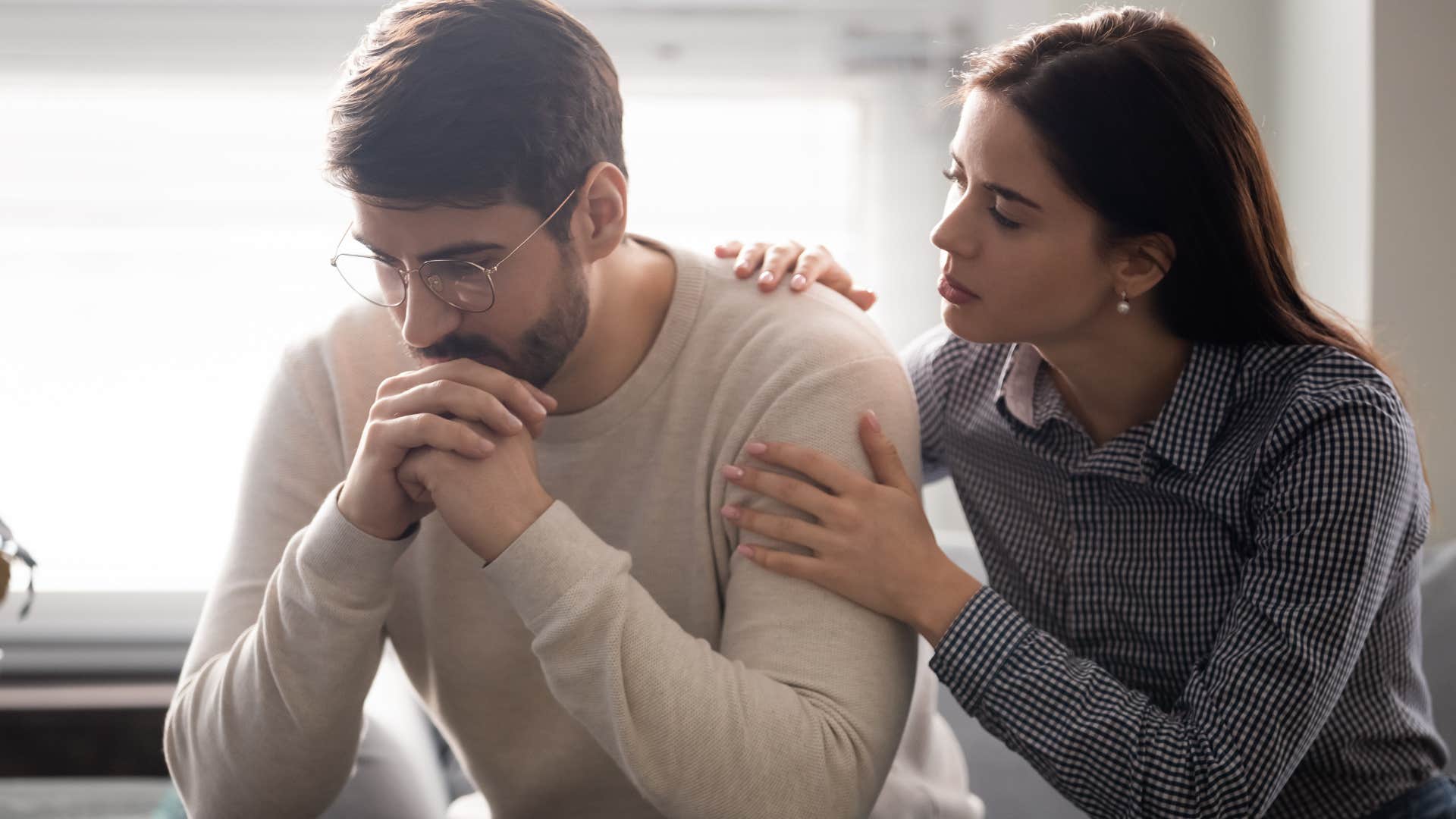 woman comforting offended man