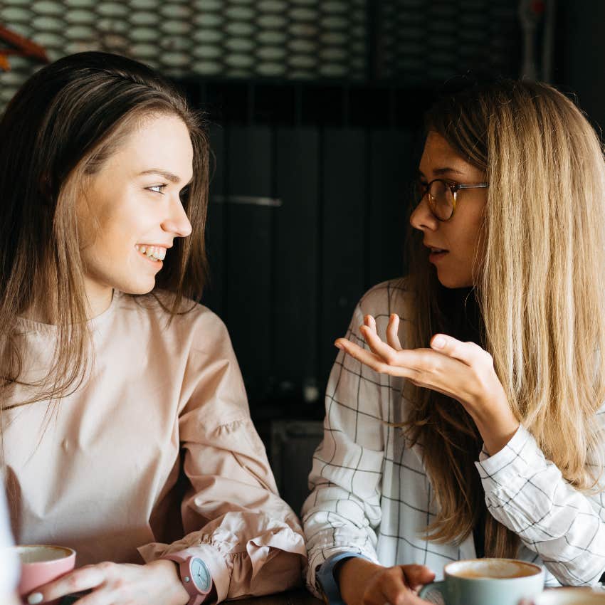 blonde woman using manipulative method to convince her friend of something