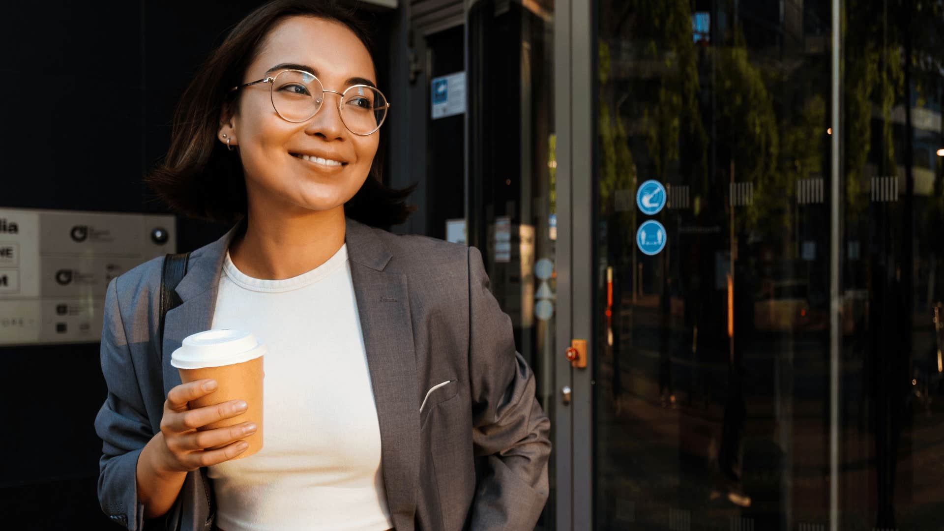 smiling gen z worker leaving work