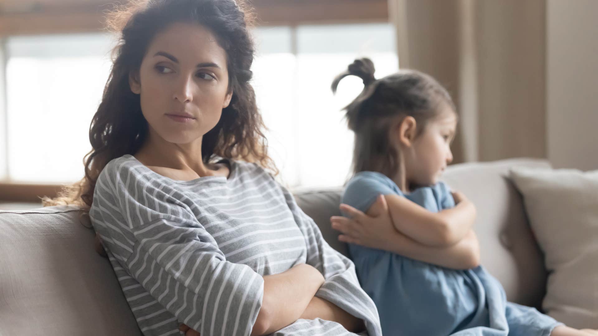 mother giving her young daughter the silent treatment