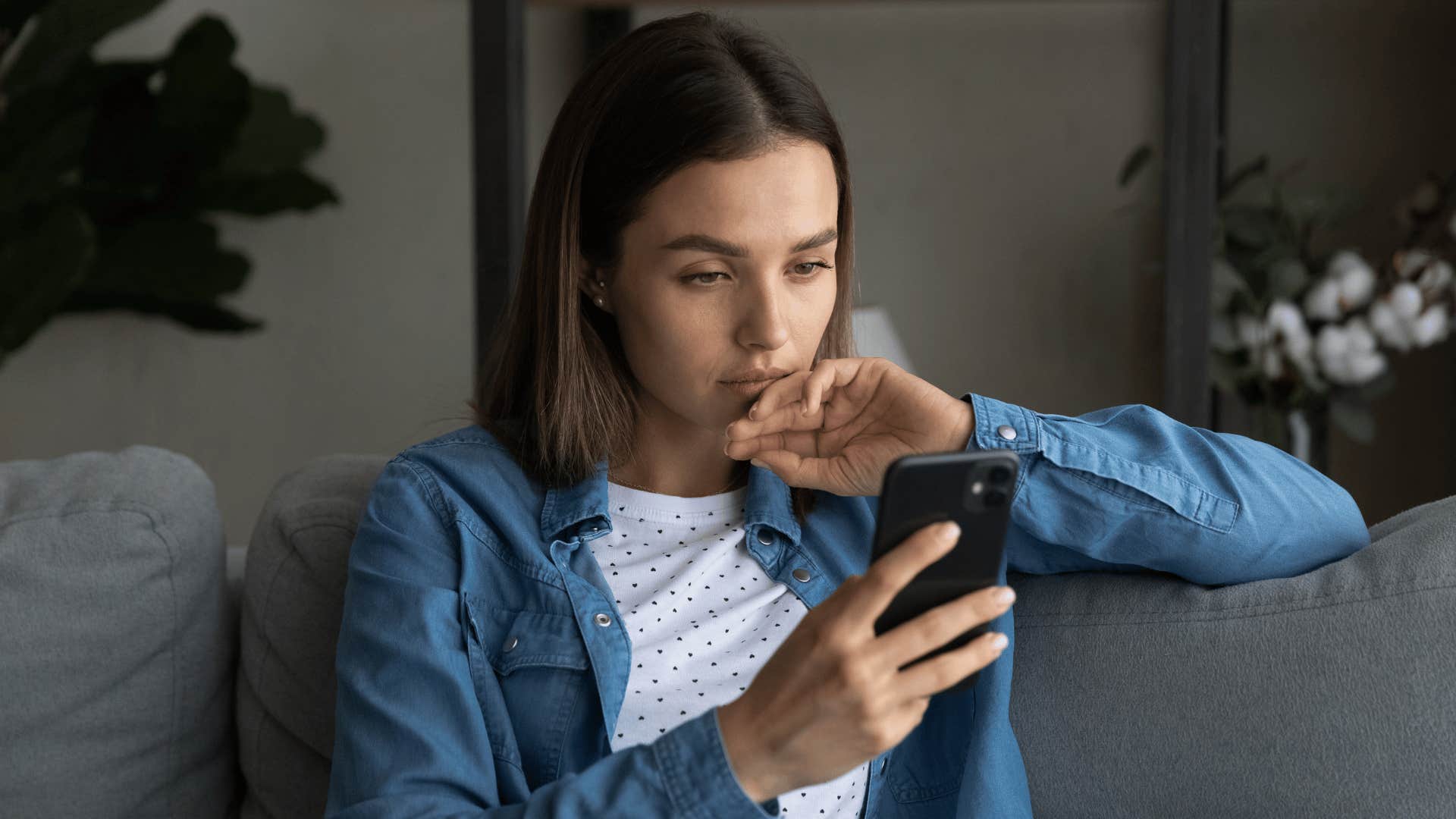 gen z woman staring at her phone