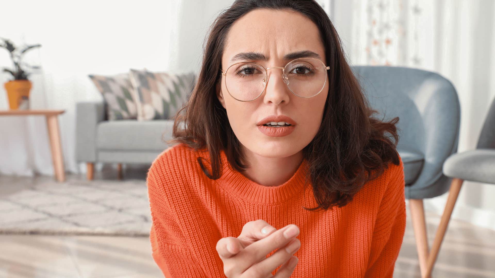 Untrusting woman points accusatory finger to question intentions