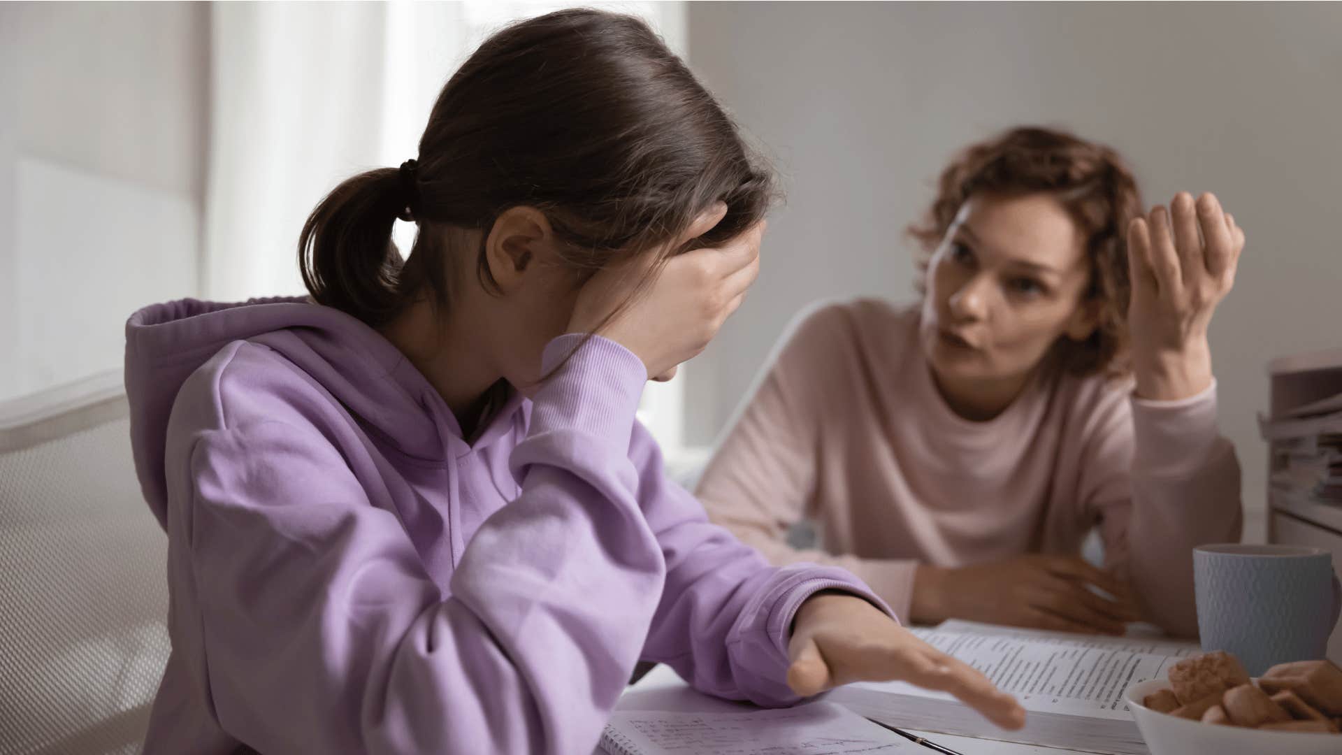 old-fashioned parent telling daughter she has a roof over her head