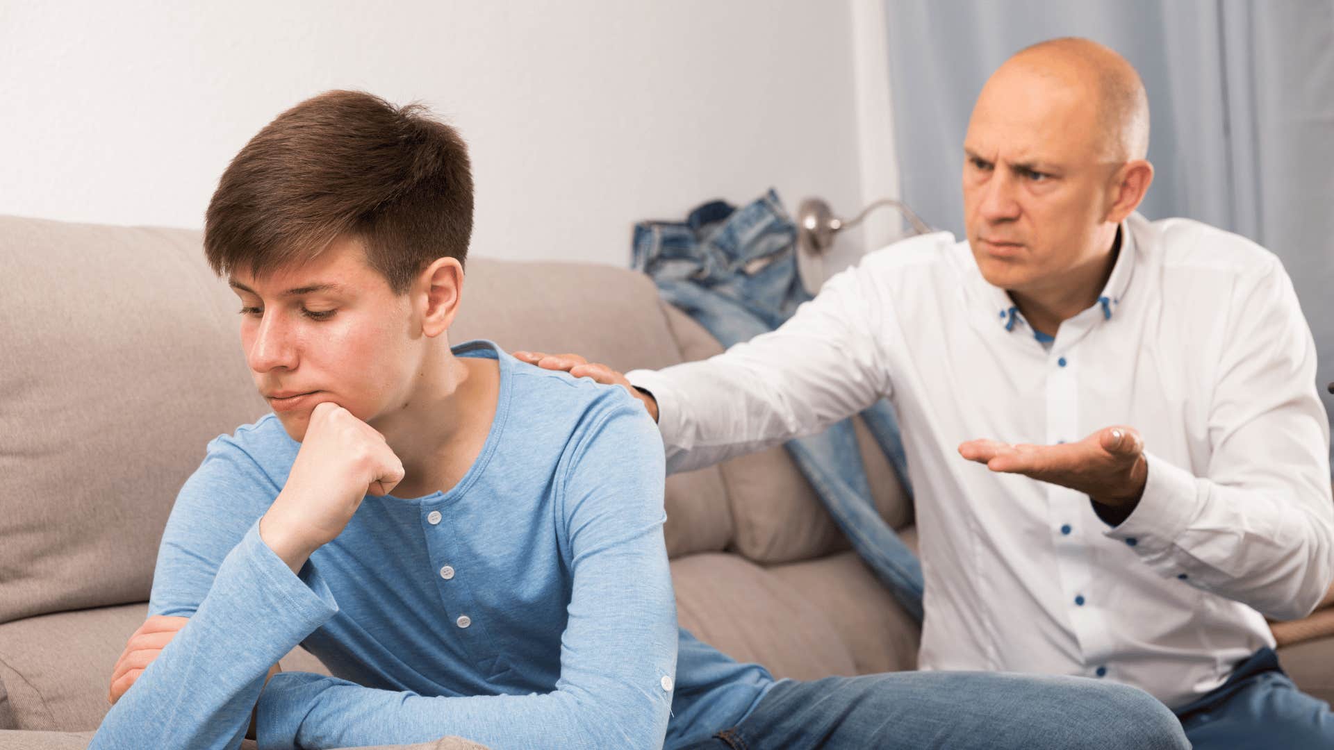 old-fashioned parent telling son other kids are starving