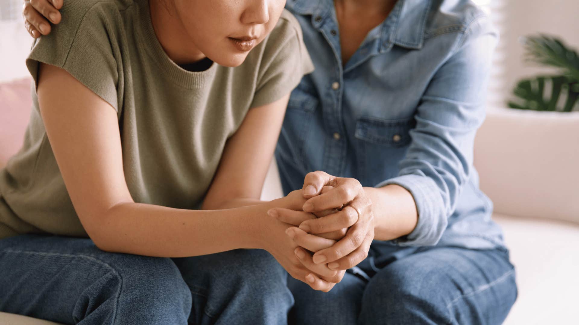 woman comforting other woman