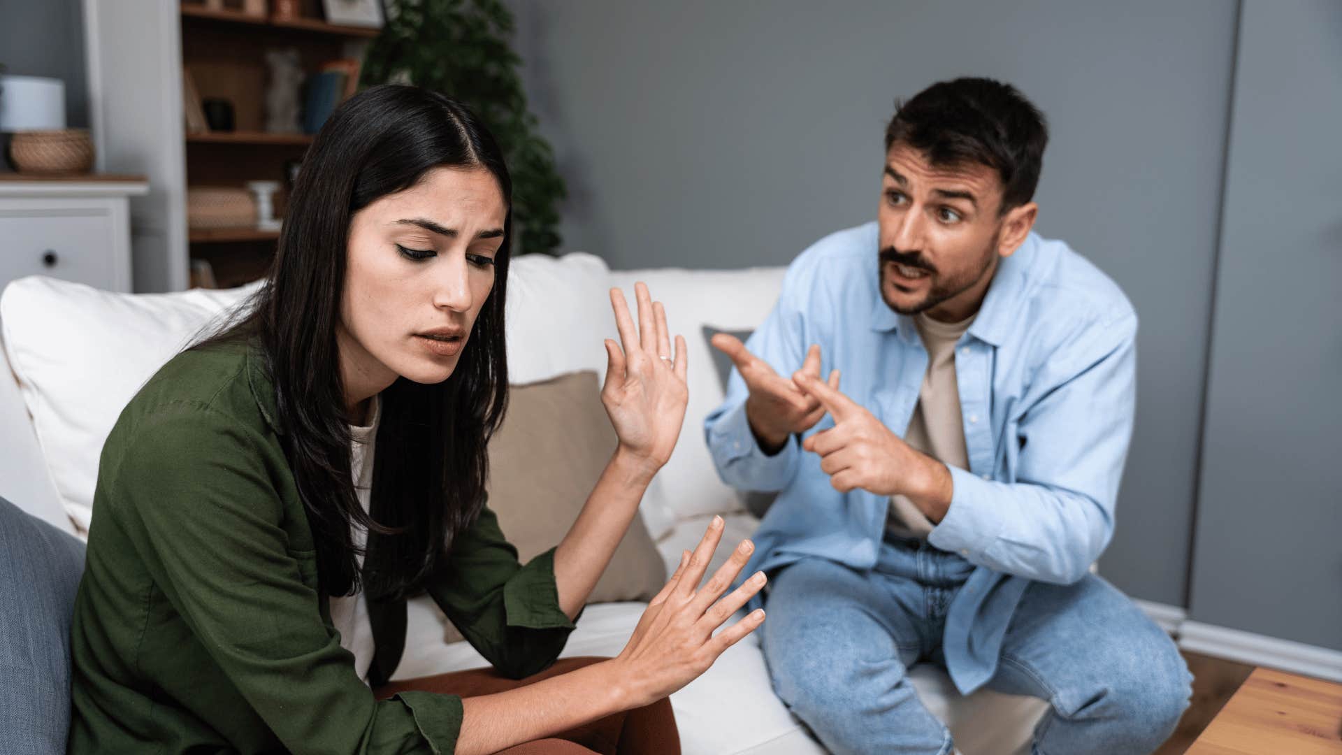 couple arguing on couch