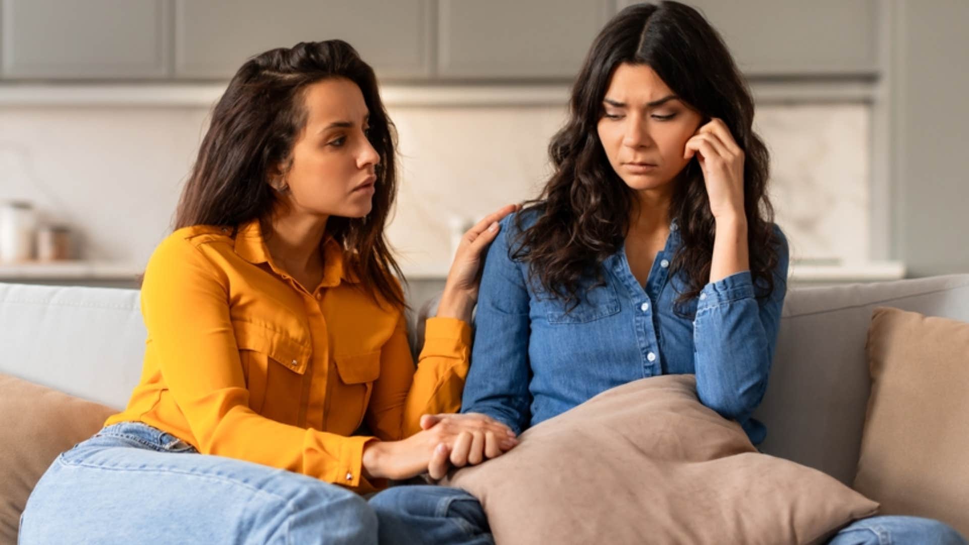 woman keeping her friend grounded during upset