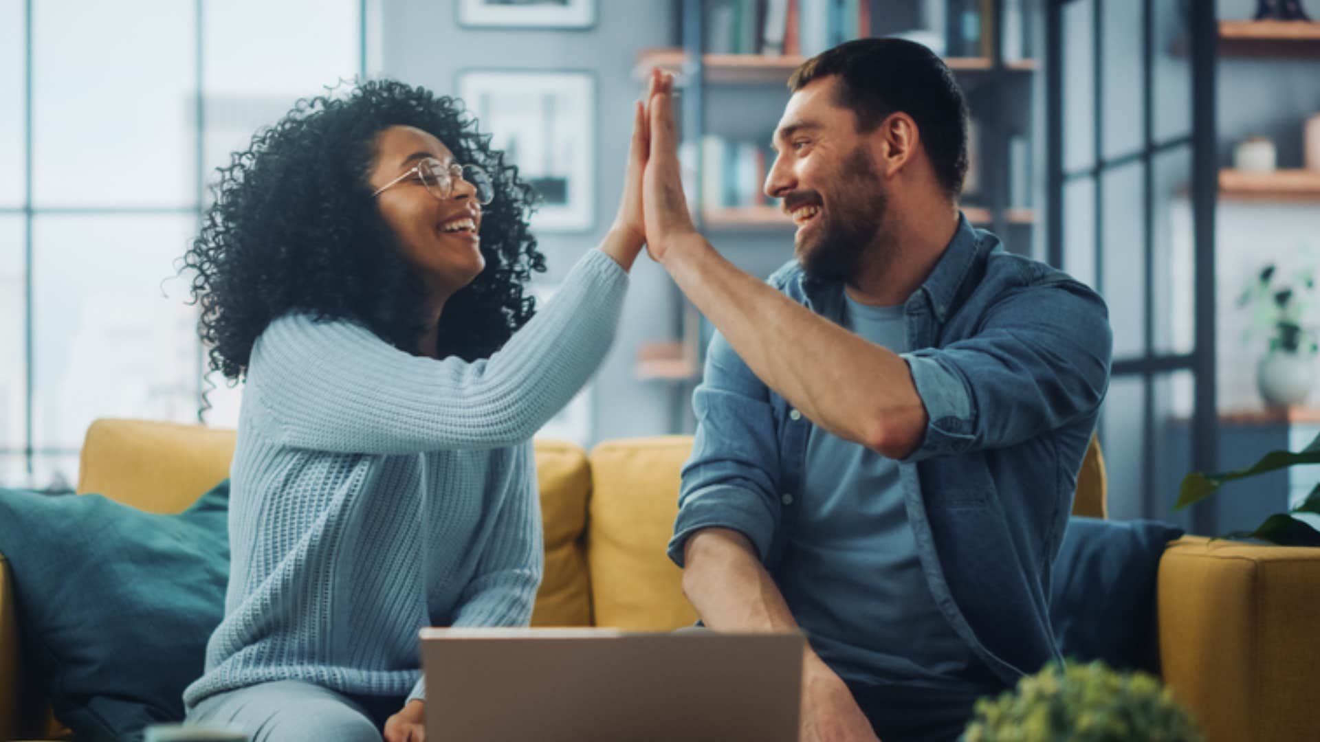 couple high-fiving after accomplishing goals