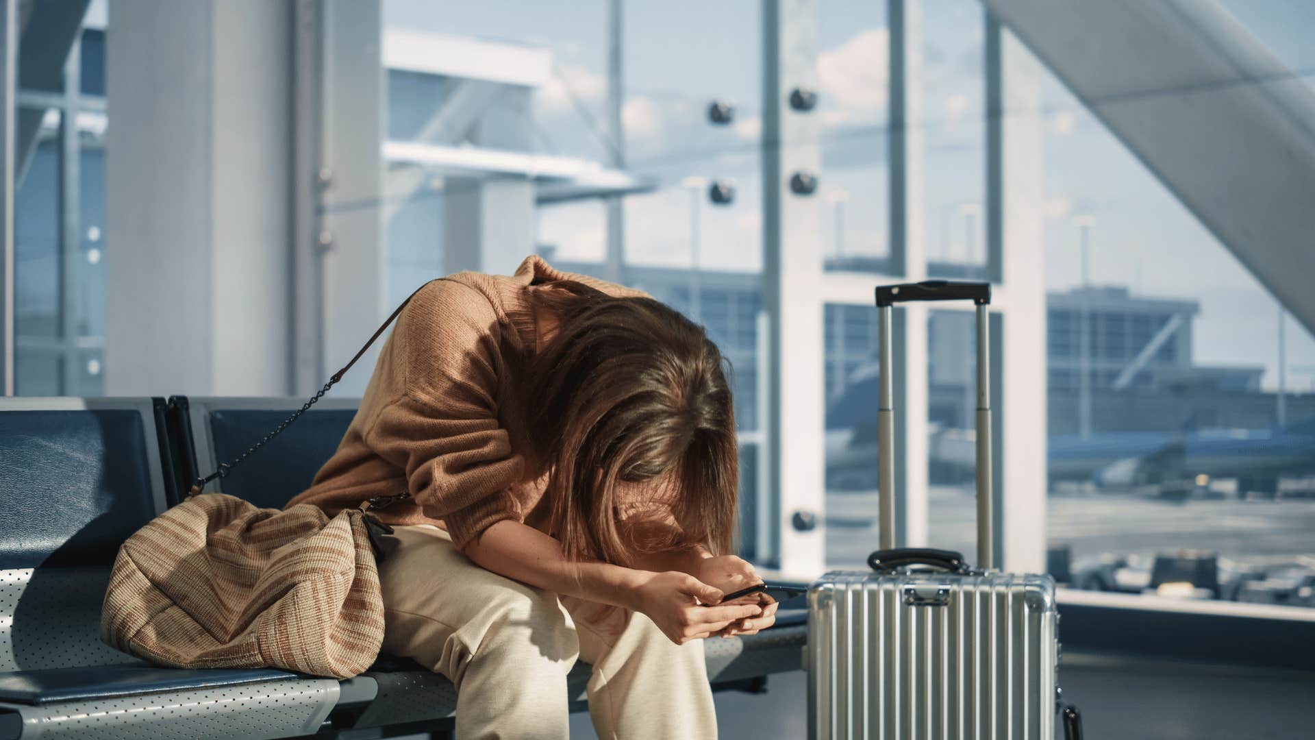 angry woman waiting in airport