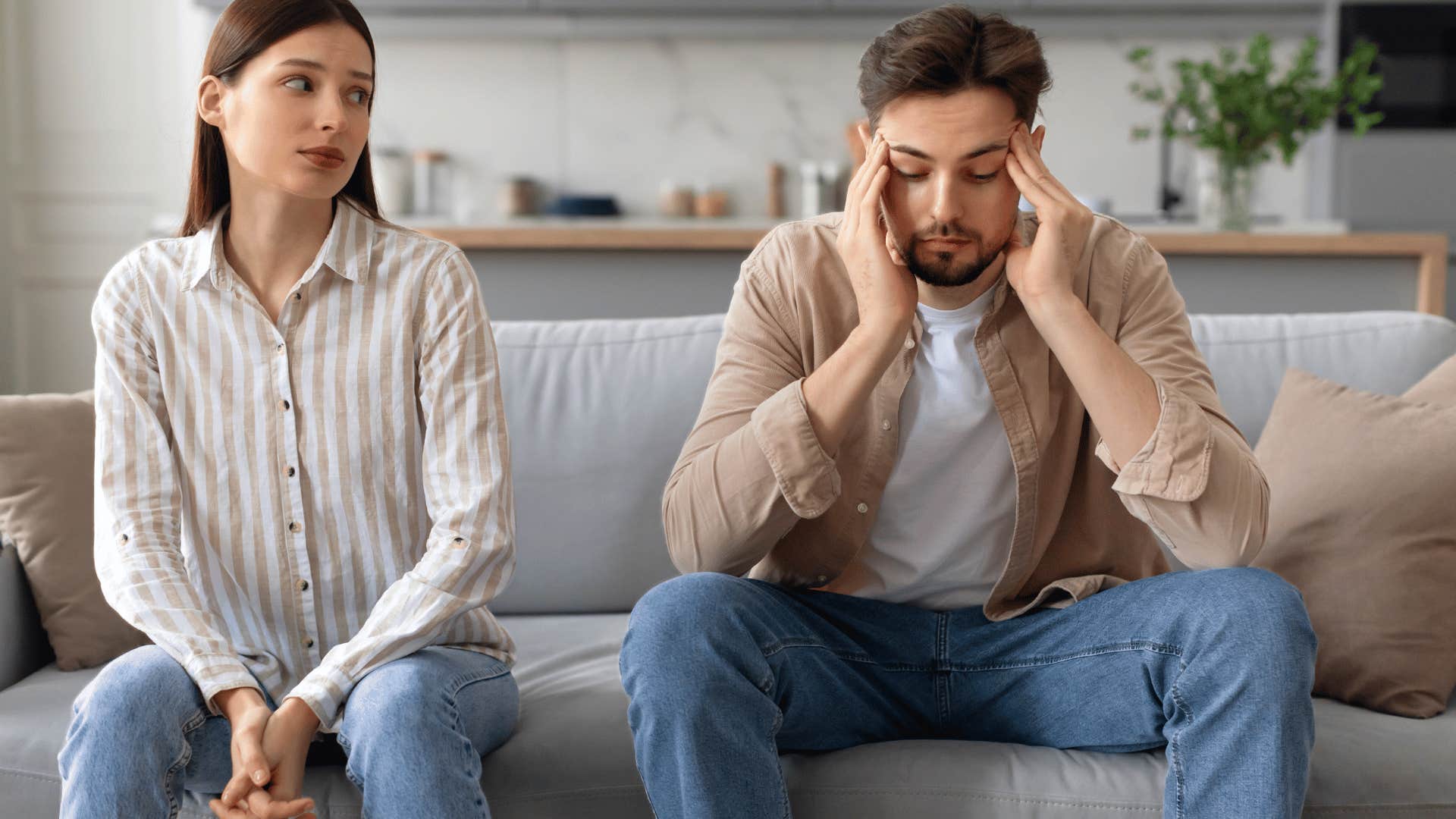 frustrated couple on couch