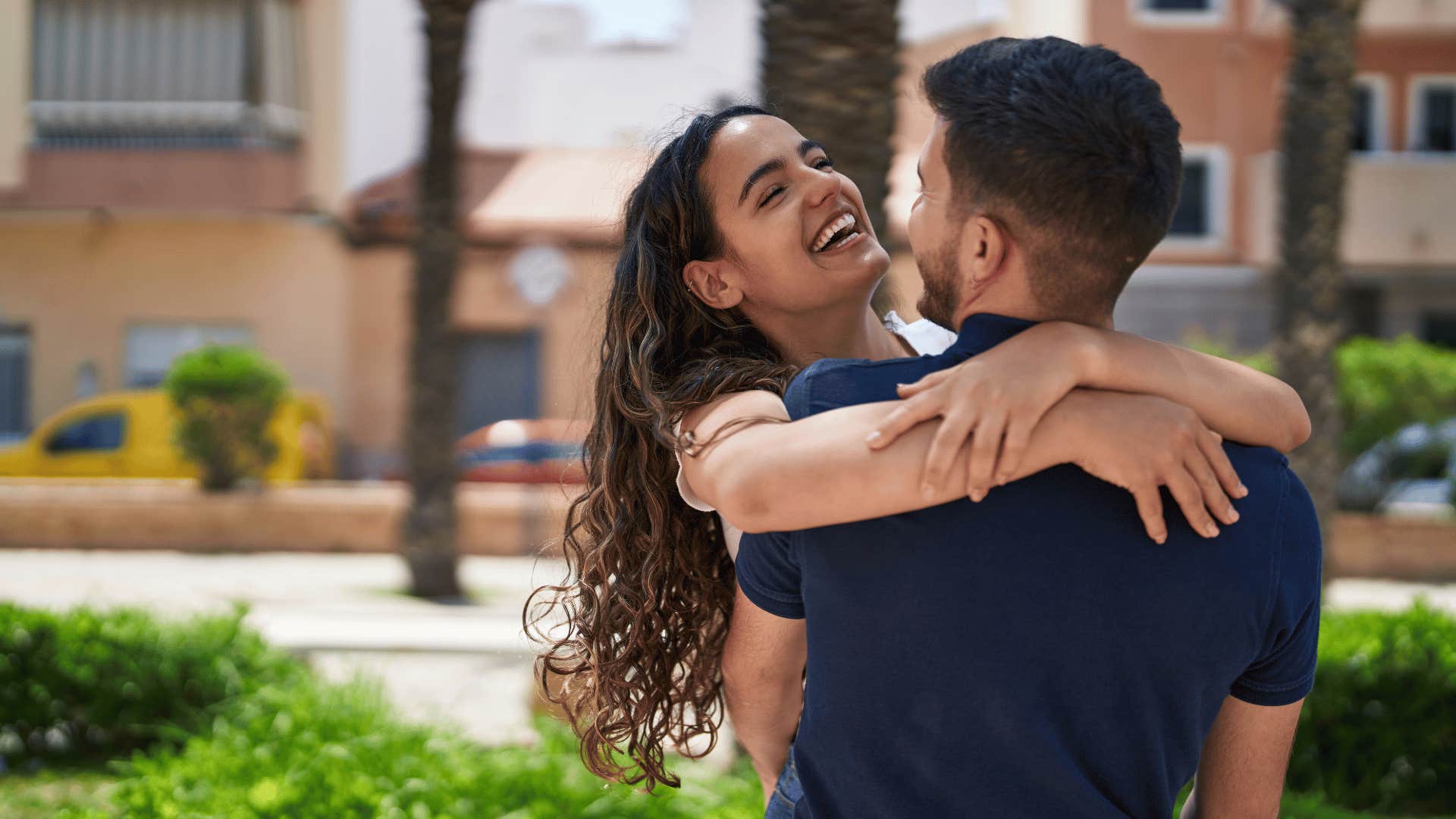 woman laughing with man with whom she has an unspoken mutual attraction