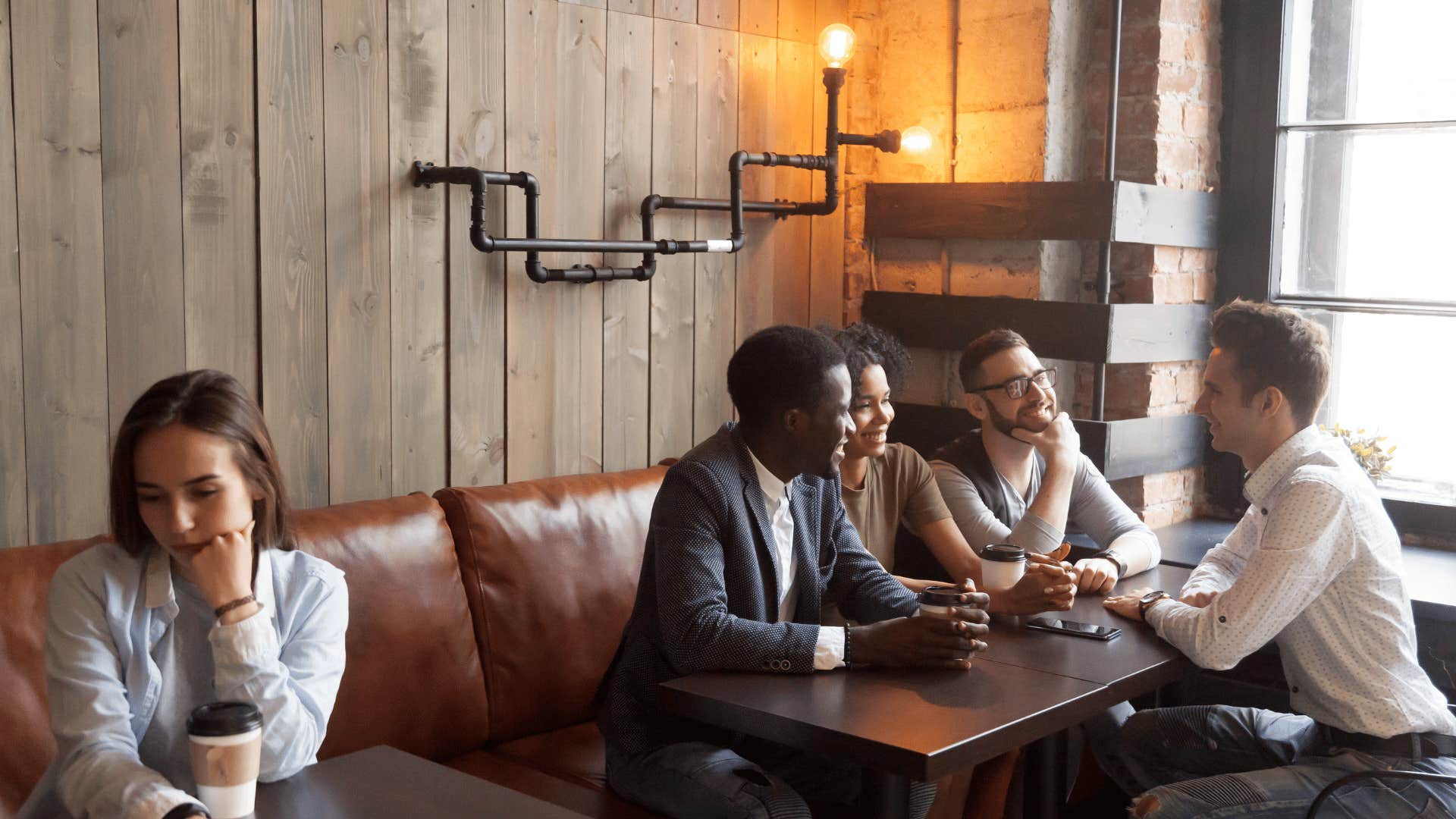 woman sitting far away from others