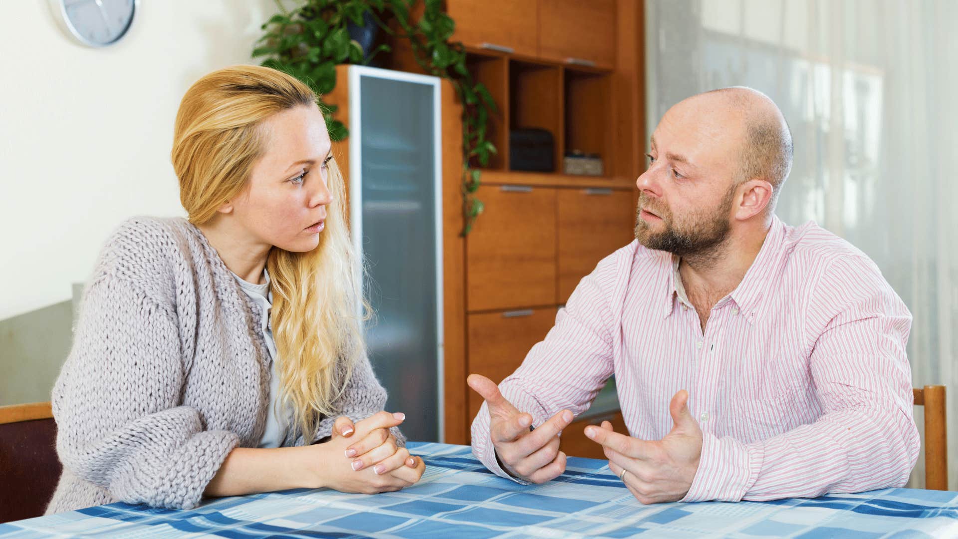 couple arguing at table