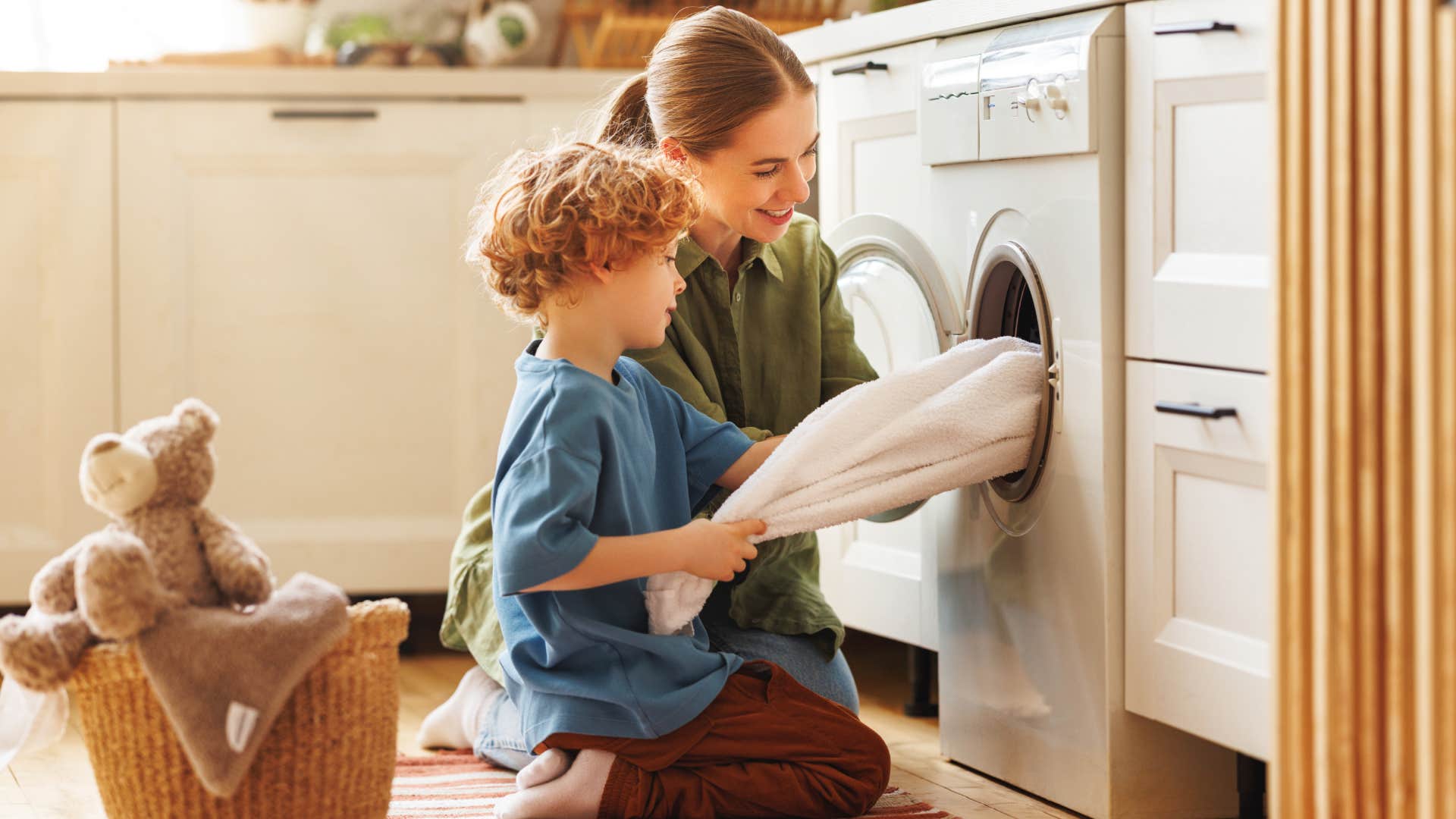 son helping mom with laundry