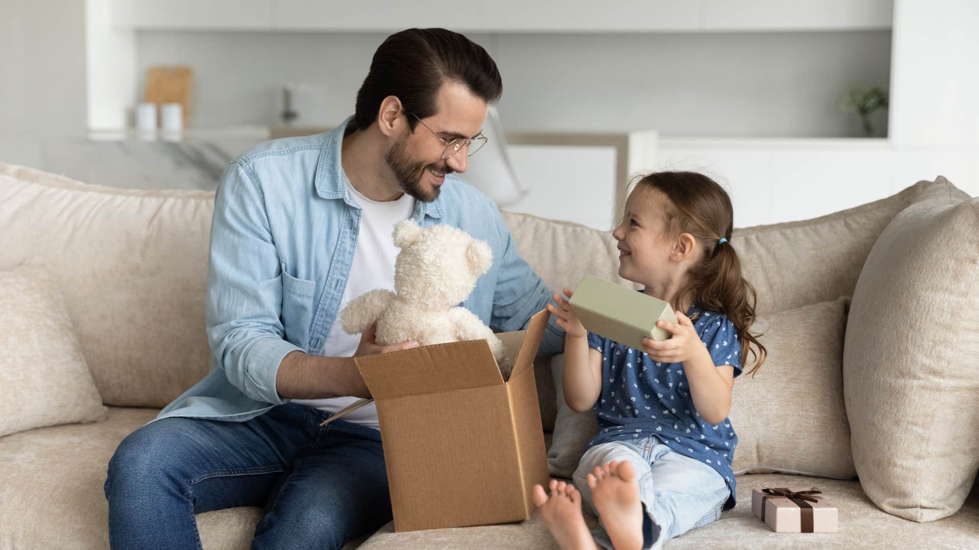 dad giving daughter gift