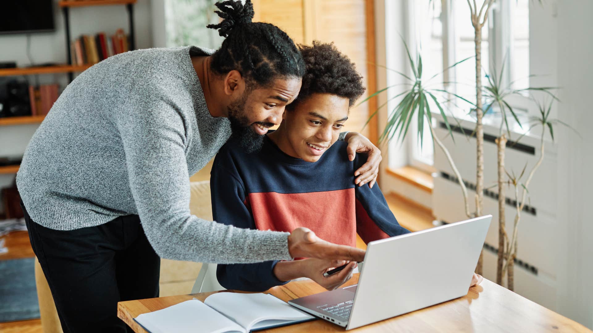 dad helping son with homework