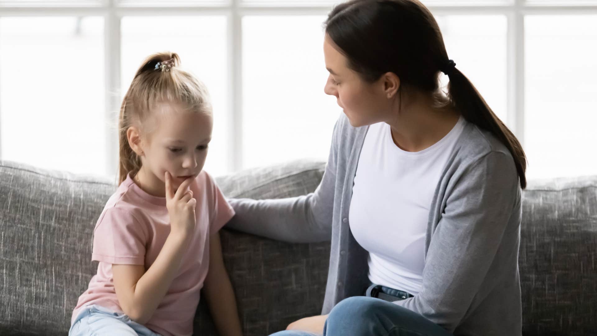 mom talking to upset daughter