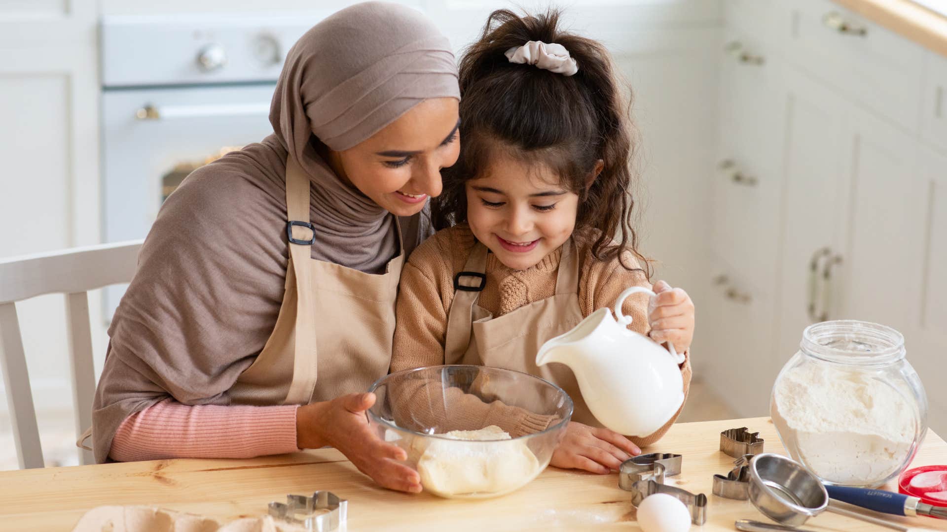 mom and daughter cooking together