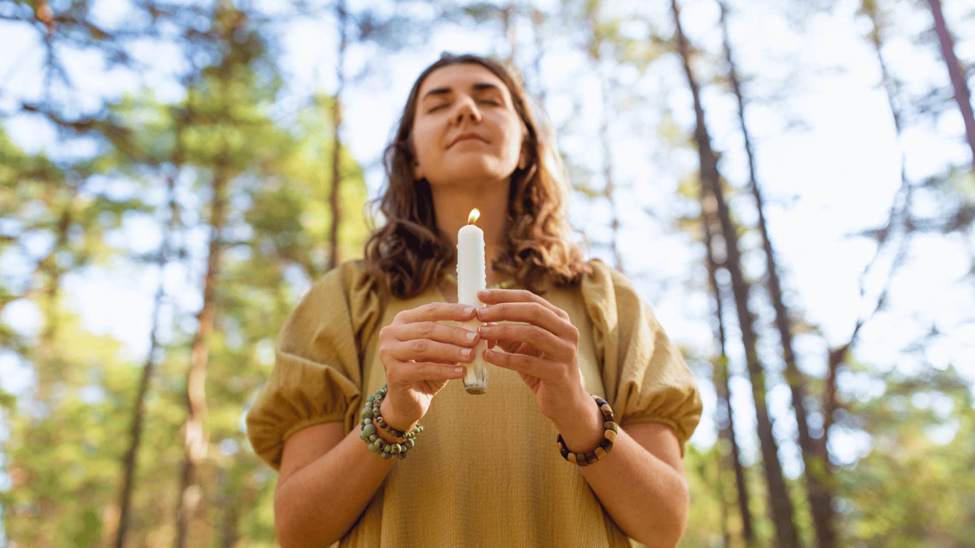 woman doing candle ritual