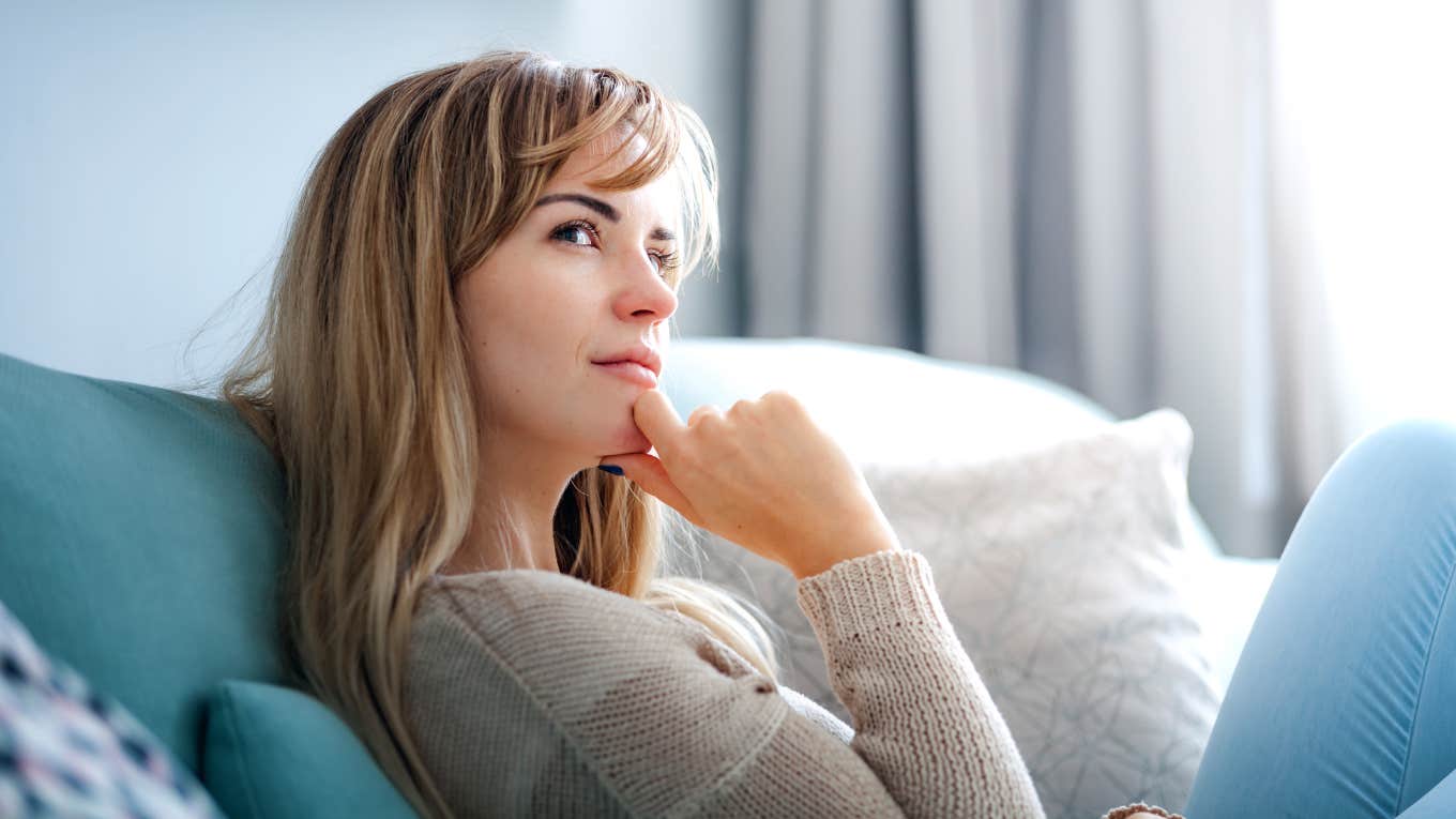 Woman thinking about why she feels so emotionally exhausted after spending time with family