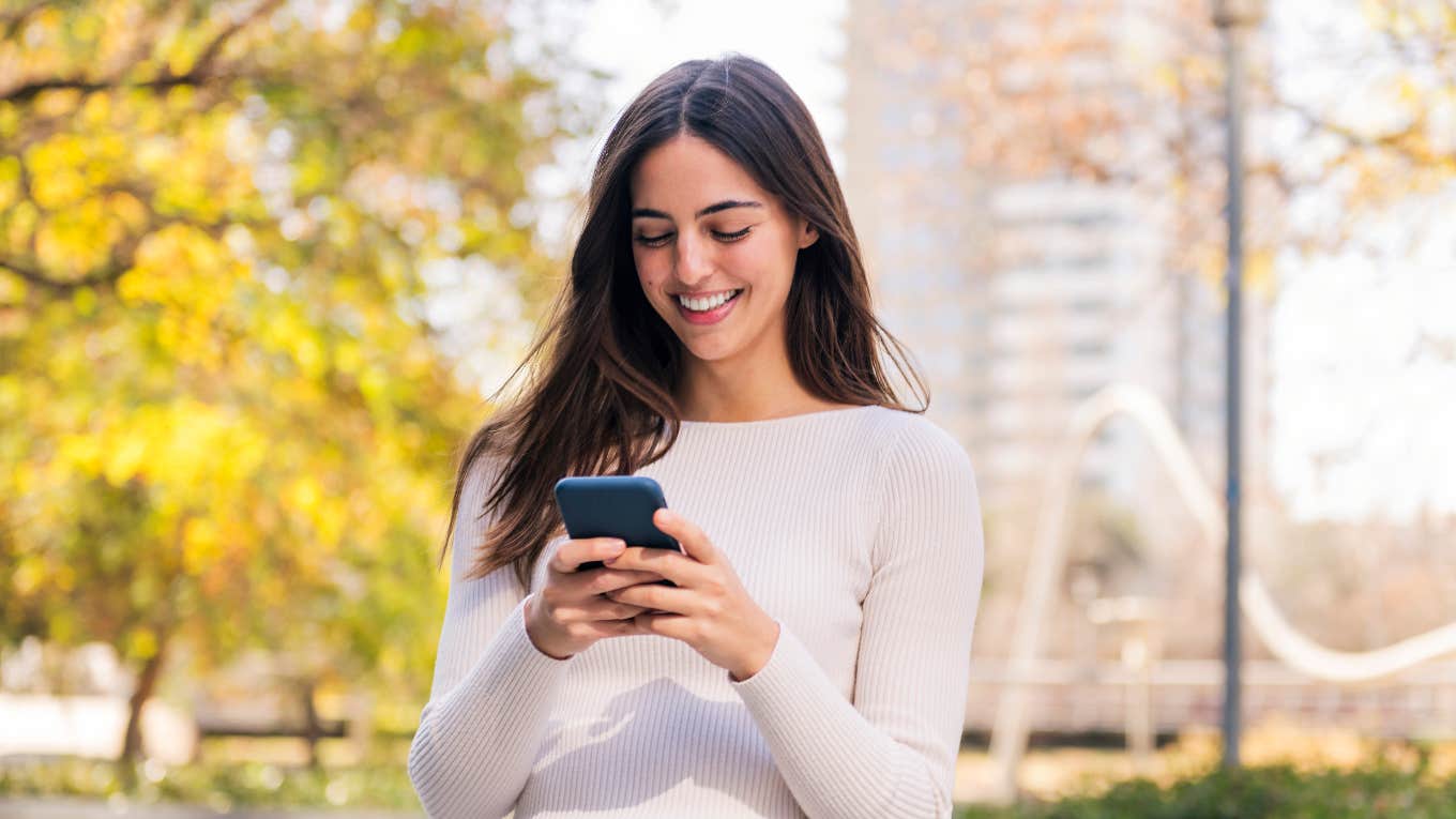 woman using social media on her phone