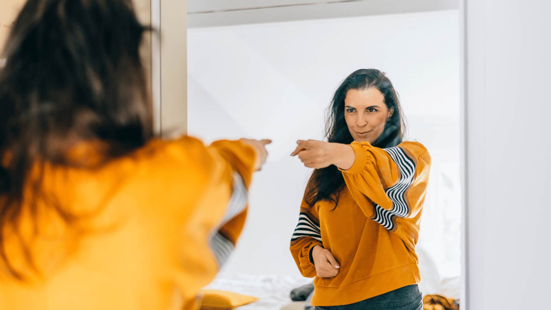 woman challenging herself in the mirror