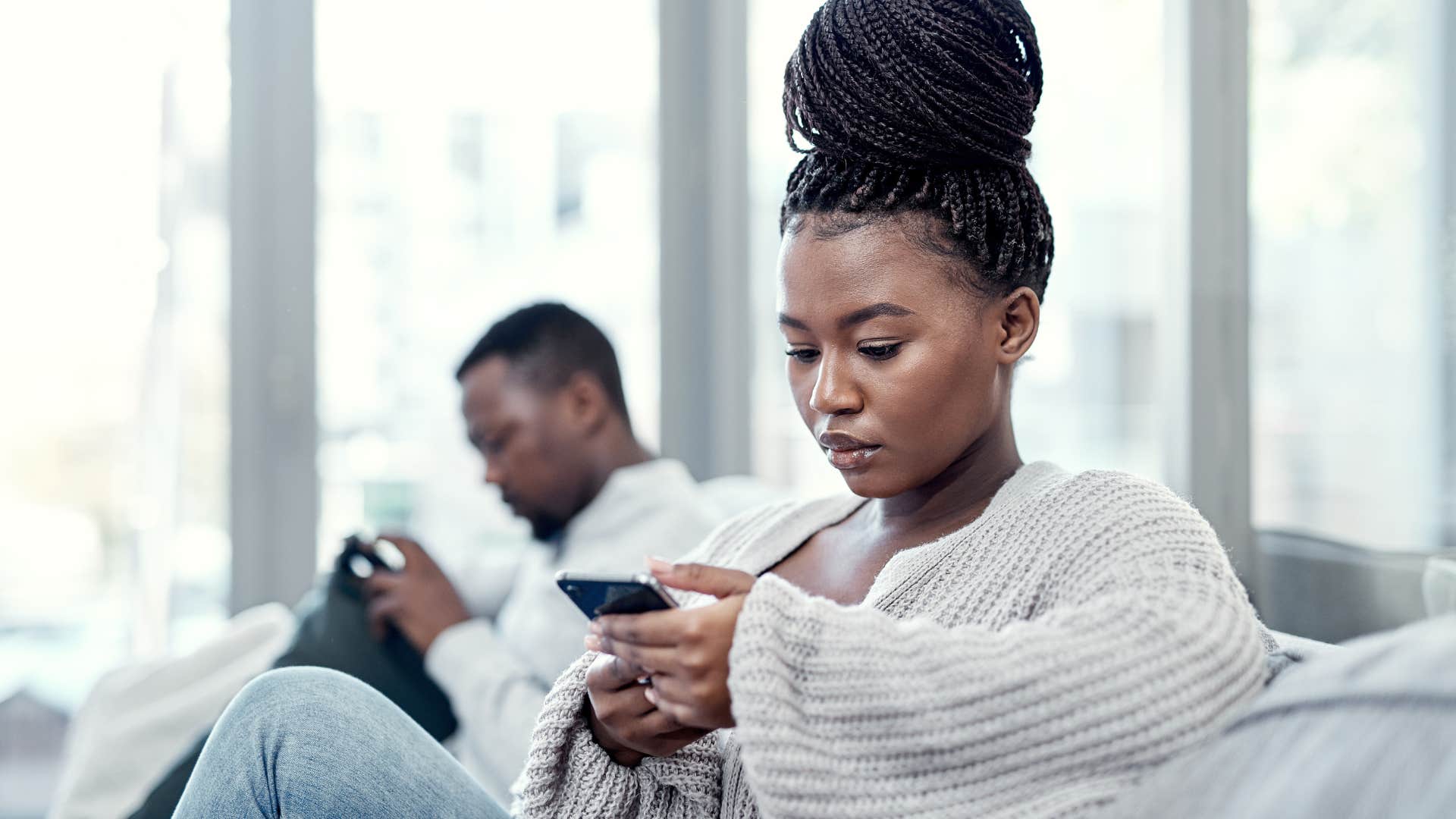 silent woman offended by subtle behaviors of the man next to her