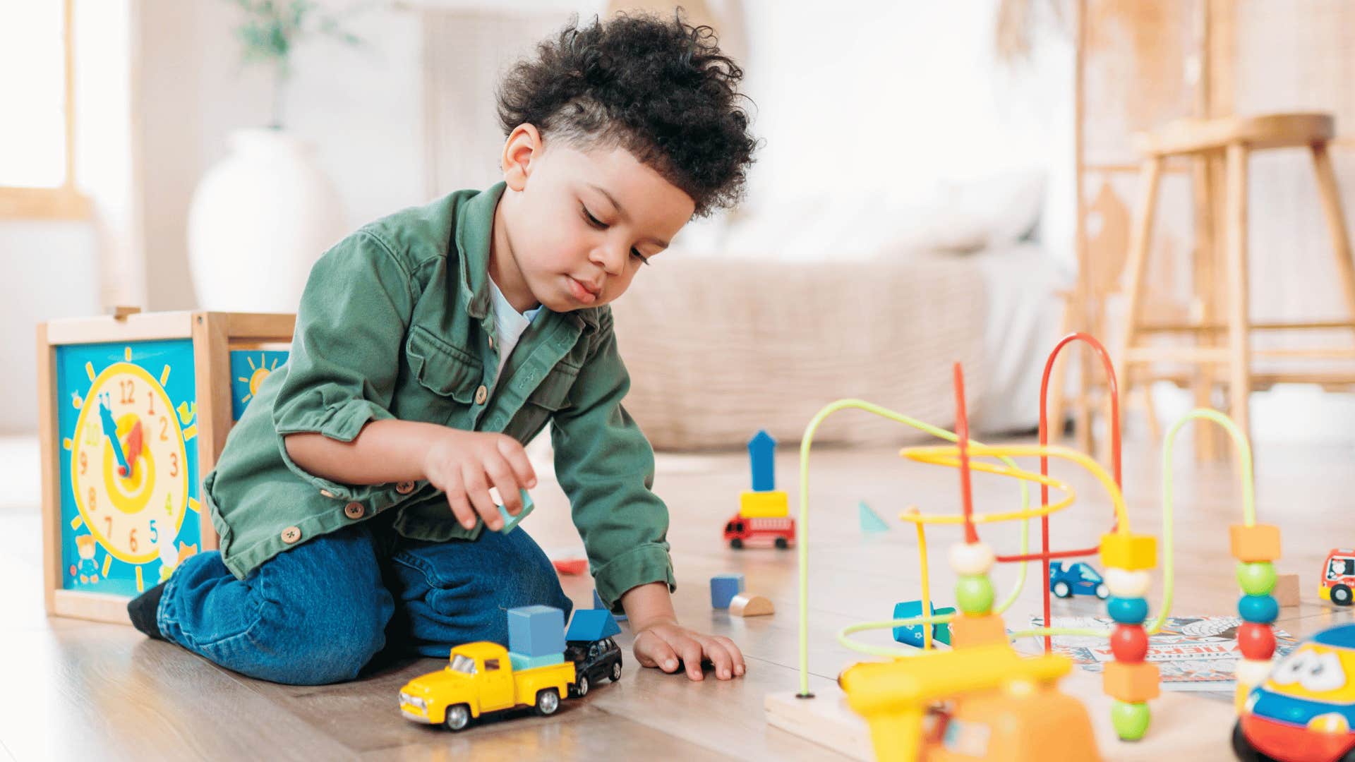 child playing alone with toys