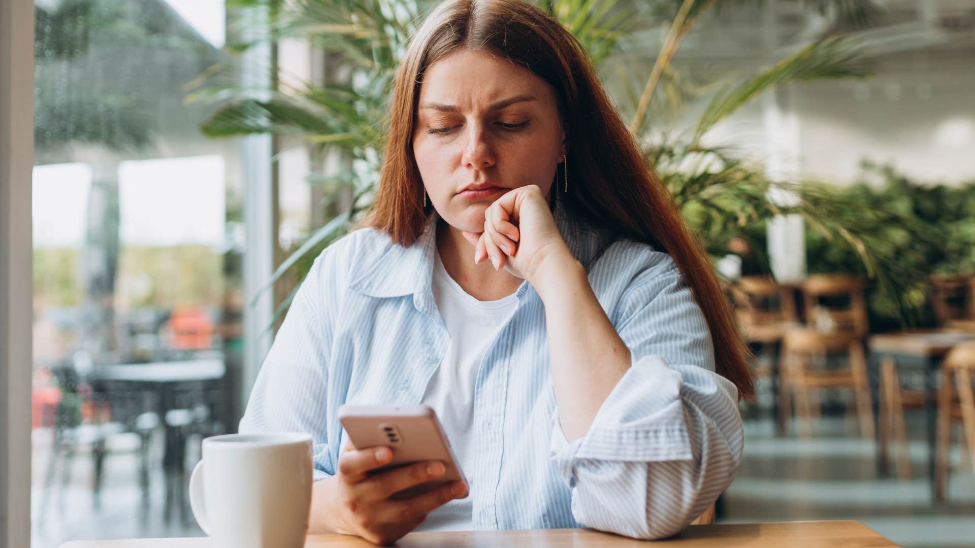 sad lonely woman texting alone