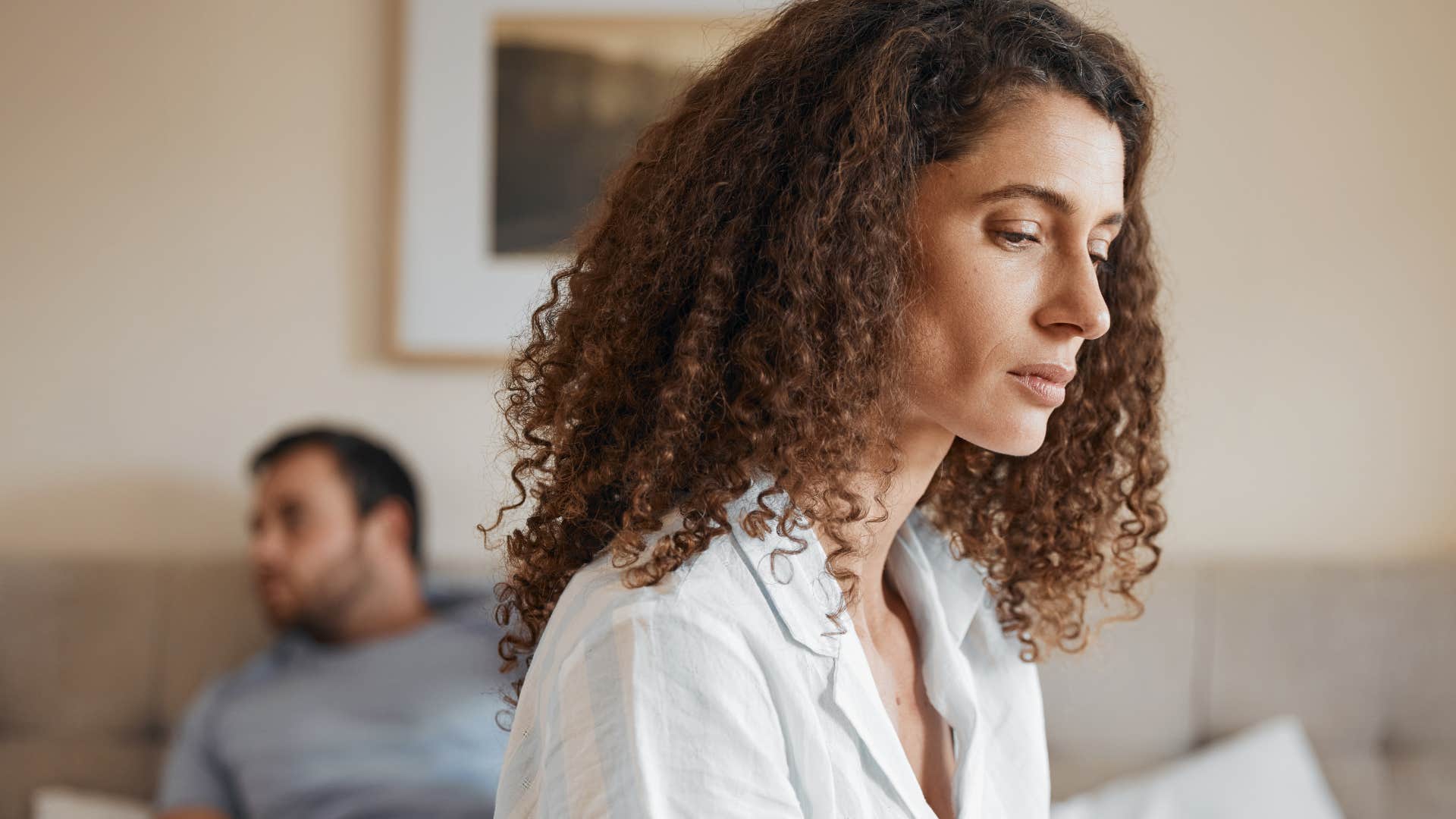 woman looking sad after being criticized by partner