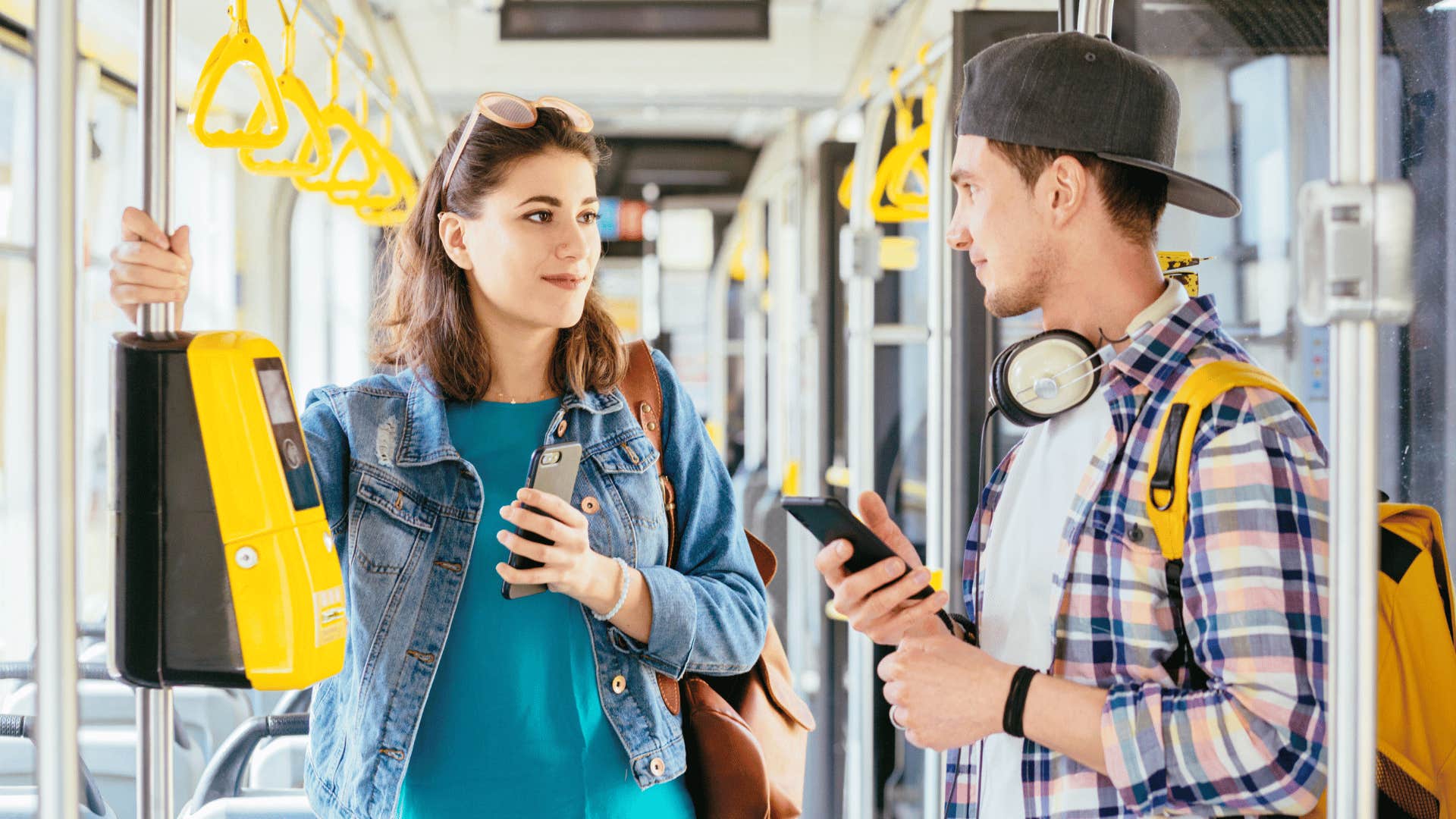 woman talking to stranger on the bus