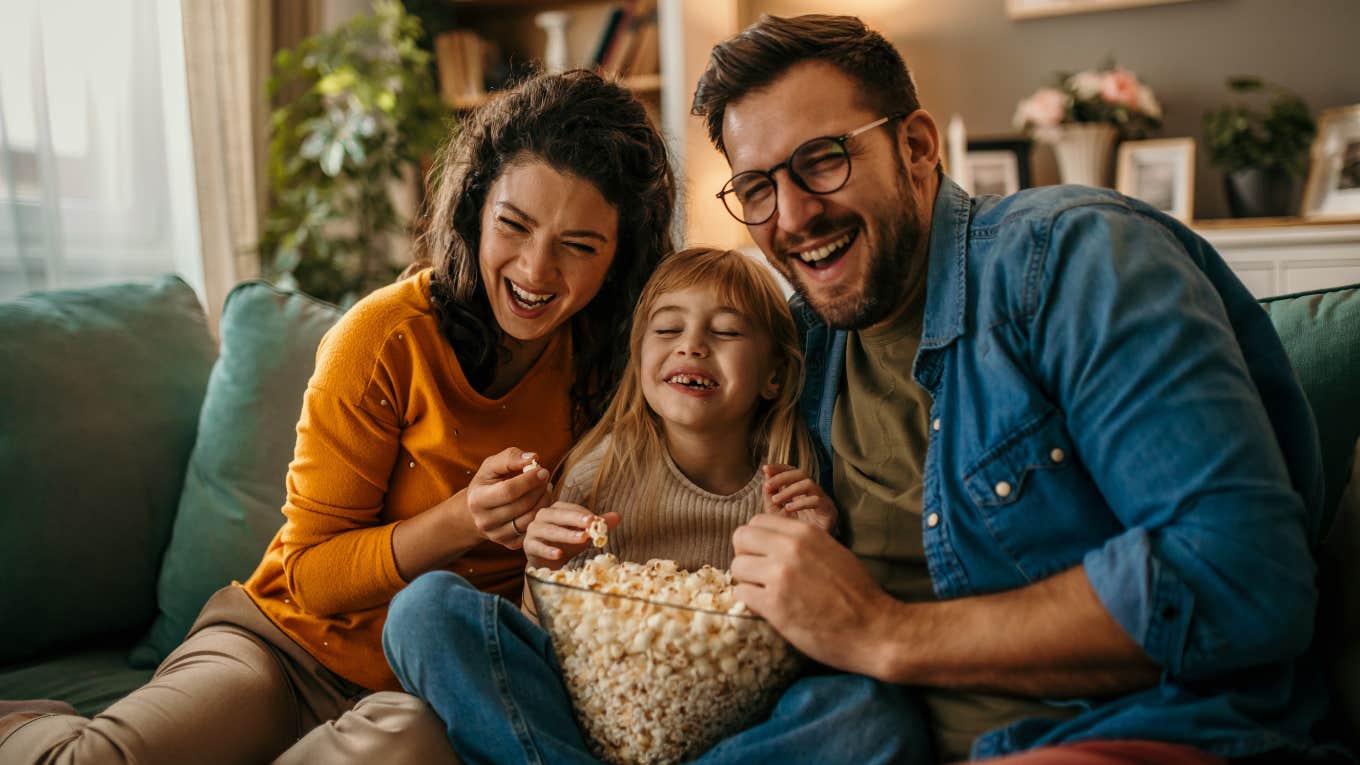 Family laughing at sitcoms featuring nontraditional TV moms