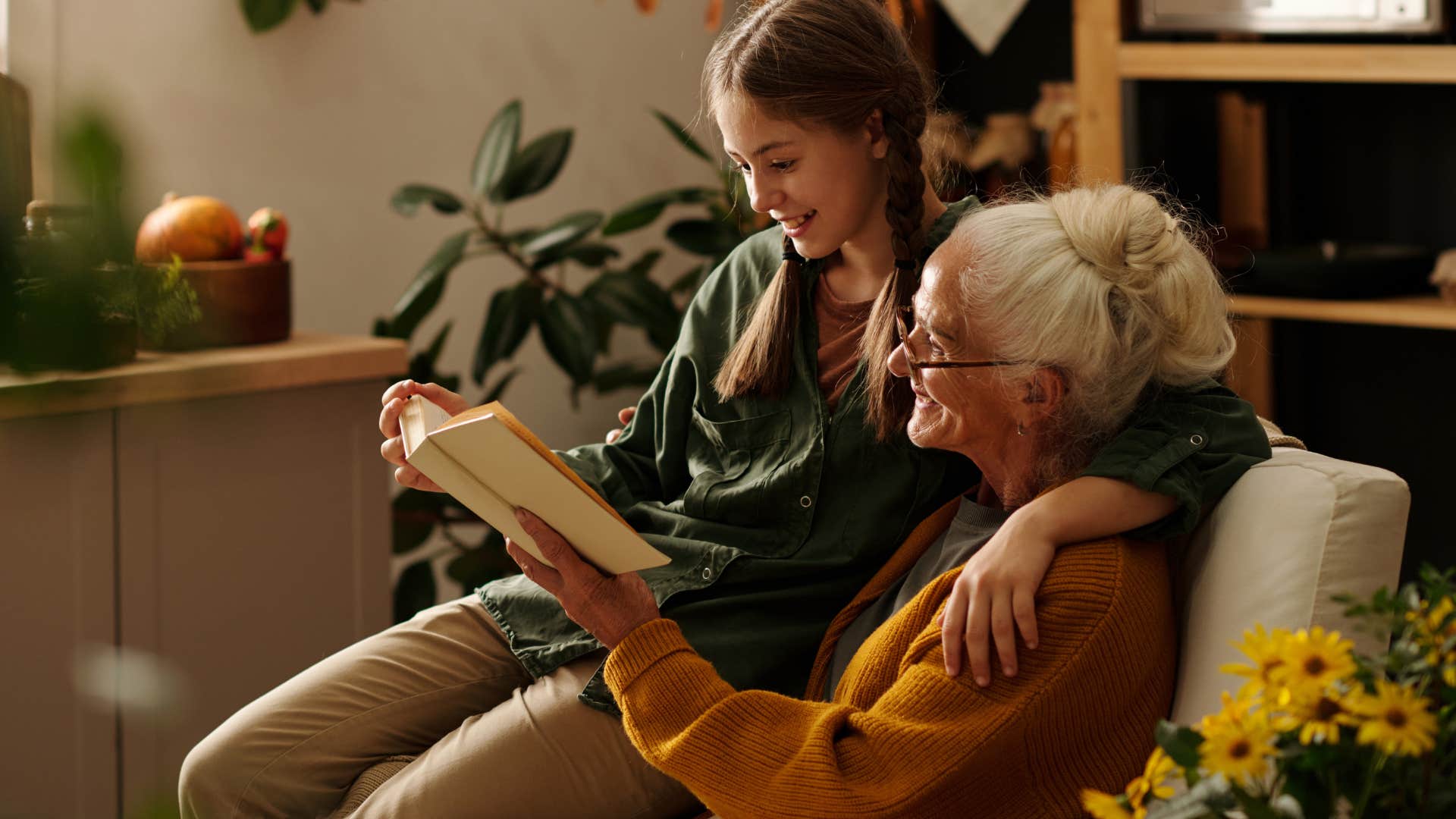 grandmother reading with teen granddaughter