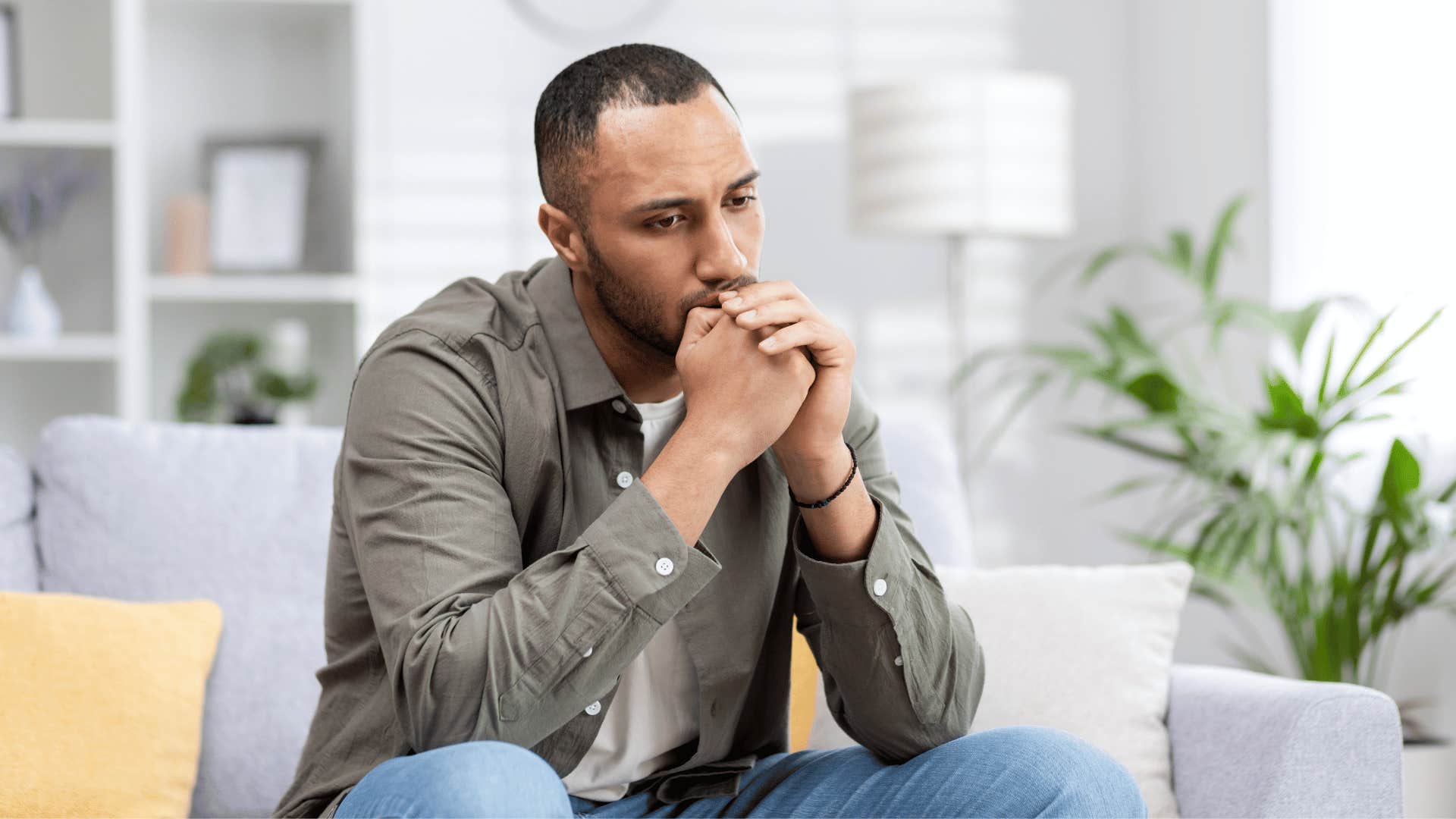 upset man on couch