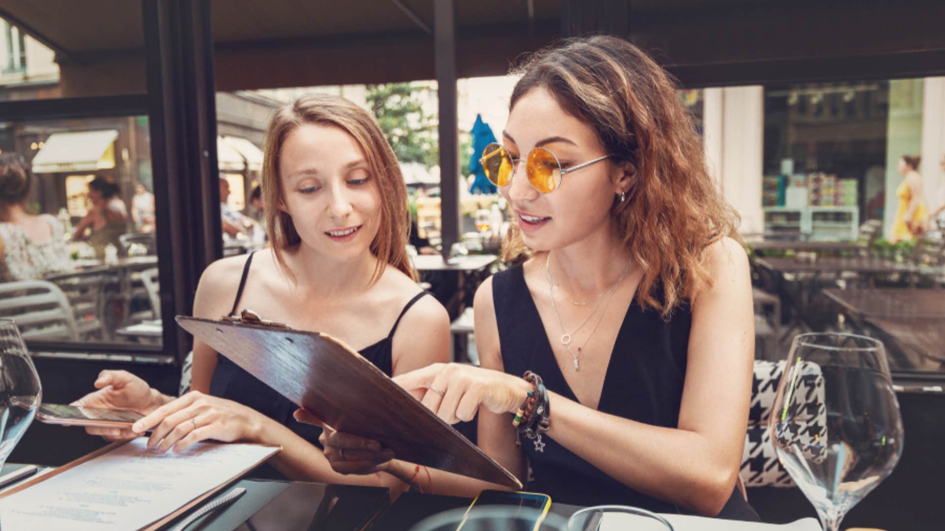 women reading printed menus at restaurants things boomers got right